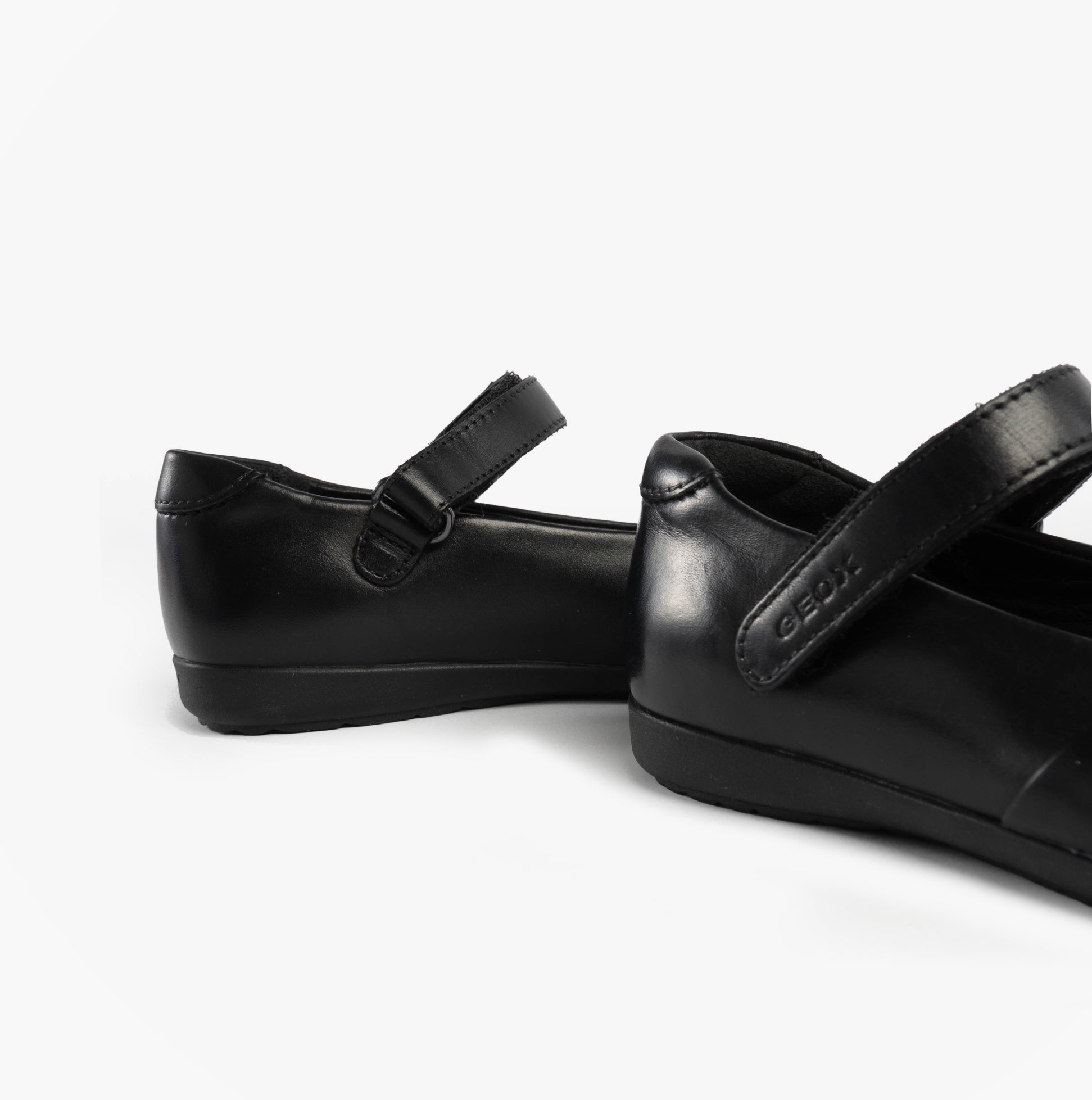 GEOX J IBERIDE Girls Mary Jane Shoes Black side view showcasing leather upper and touch fasten strap.
