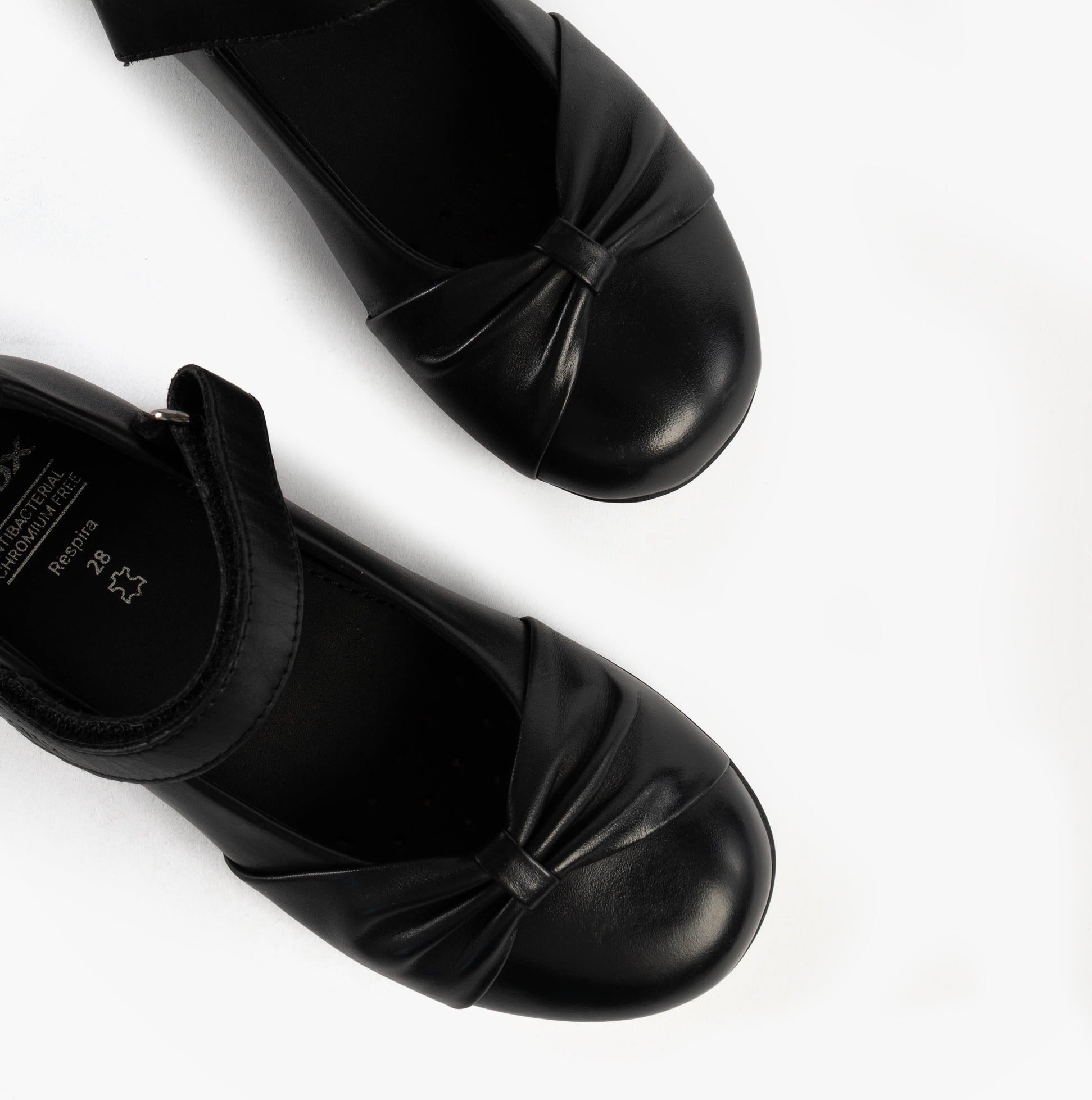 GEOX J IBERIDE Girls Mary Jane Shoes Black top view showing the round toe and strap details on the black leather upper.