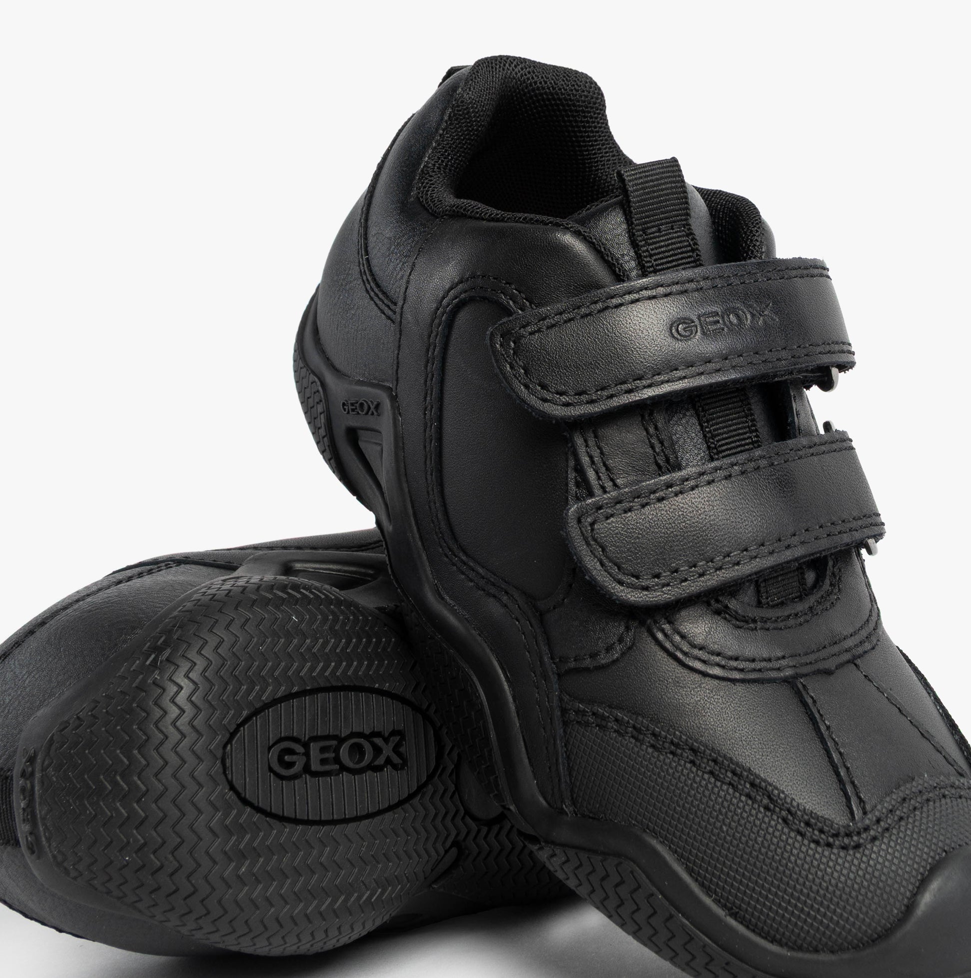 GEOX JR WADER Unisex Kids Black shoe, side view showing black leather and synthetic upper with touch fastening.