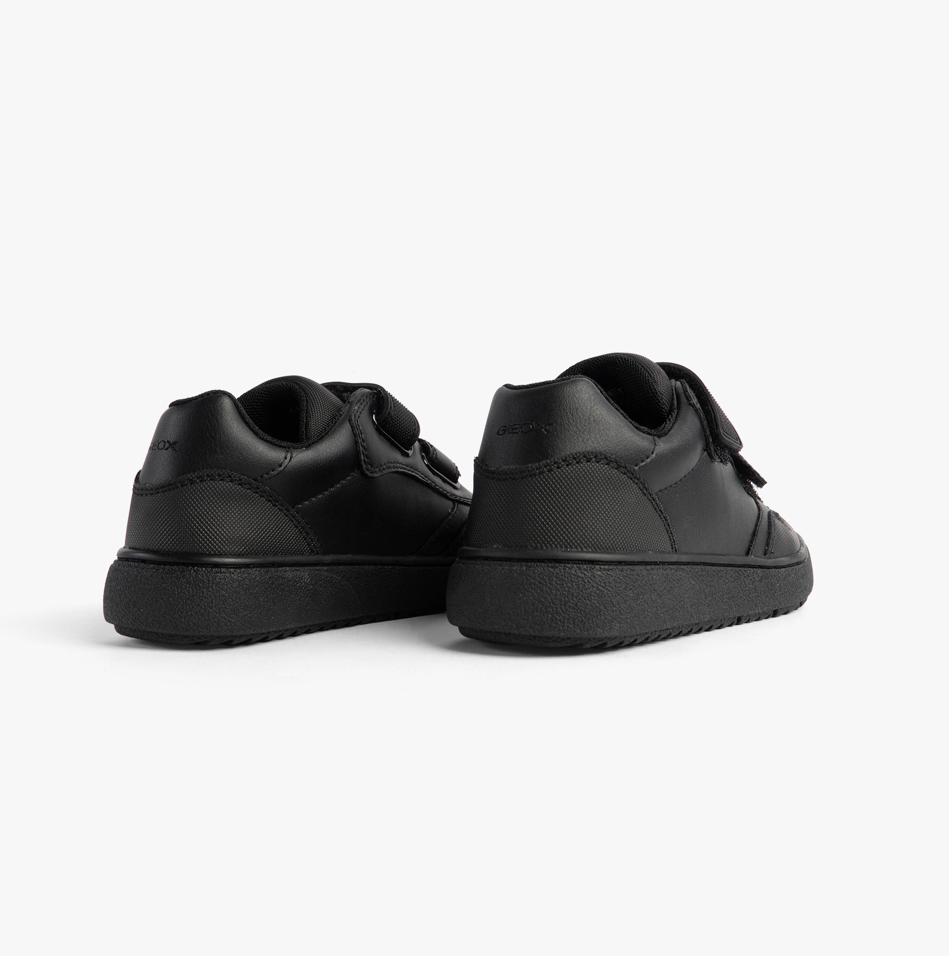 GEOX J THELEVEN BOY Unisex Kids Black shoe back view showcasing smooth leather and rubber sole.