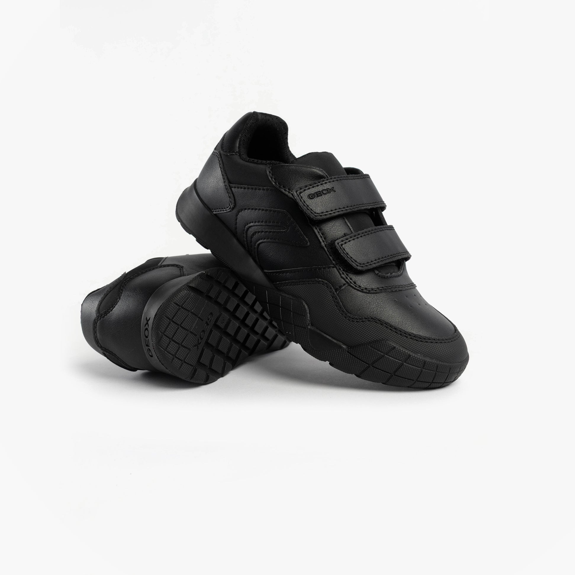 GEOX J RANN-E BOY Unisex Kids Touch Fasten Trainers Black side view showing black synthetic upper and touch fasten straps