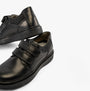 GEOX J RIDDOCK Boys Shoes Black detail view showcasing leather upper and touch fastening straps.