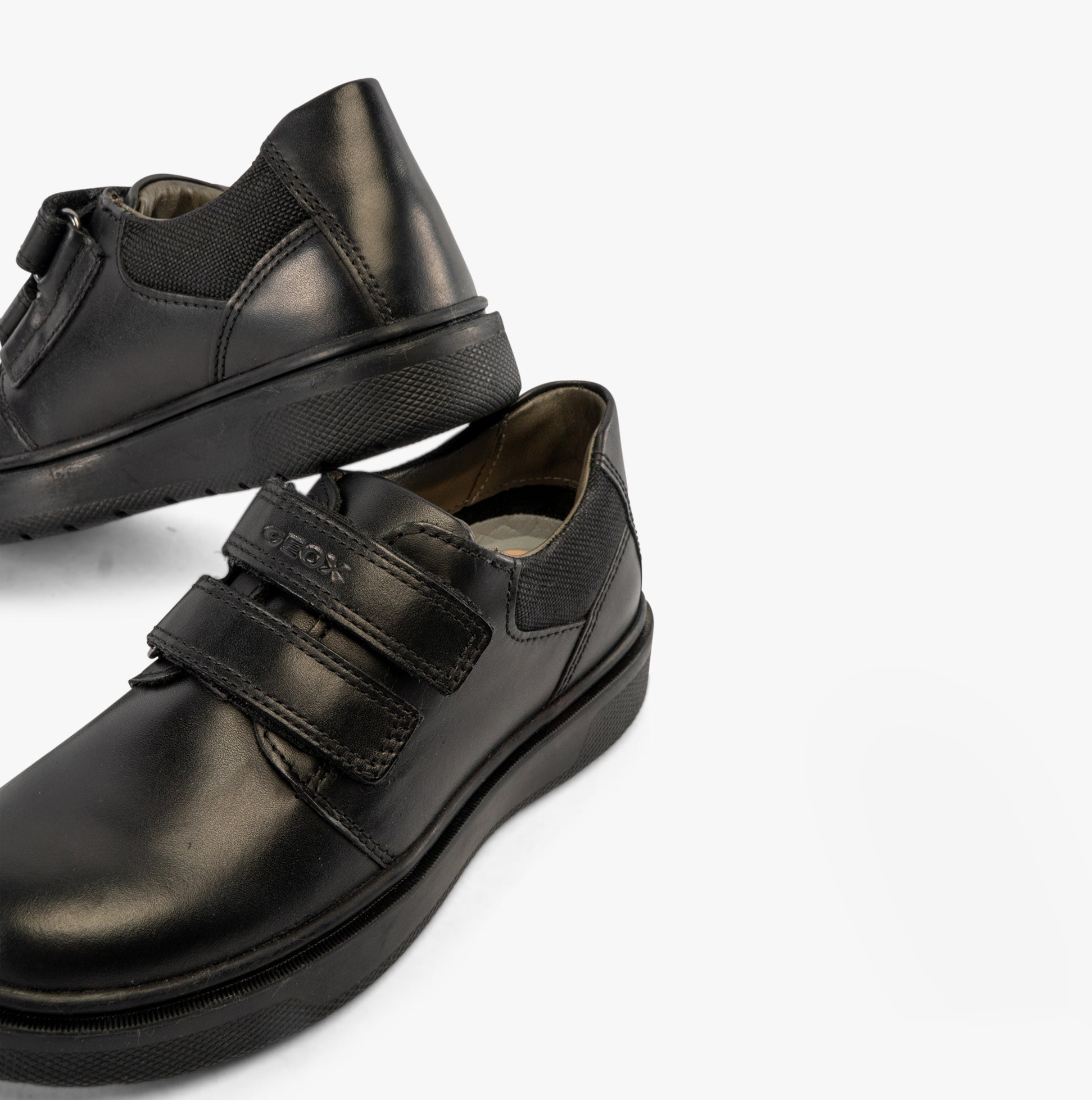 GEOX J RIDDOCK Boys Shoes Black detail view showcasing leather upper and touch fastening straps.
