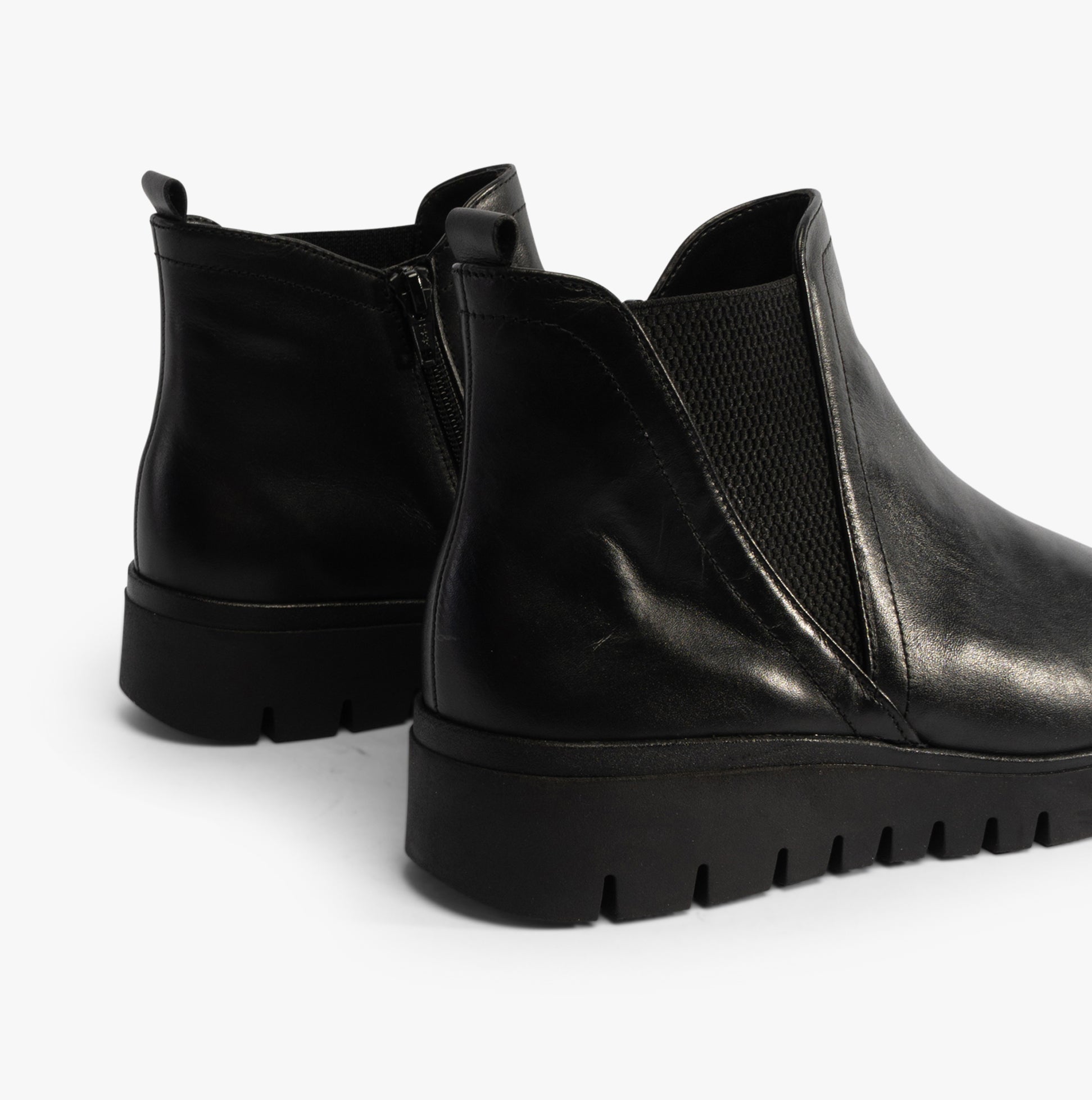 Gabor DUBLIN Womens Boots Black side view showcasing black leather ankle boots with elasticated side panel and wedge sole.