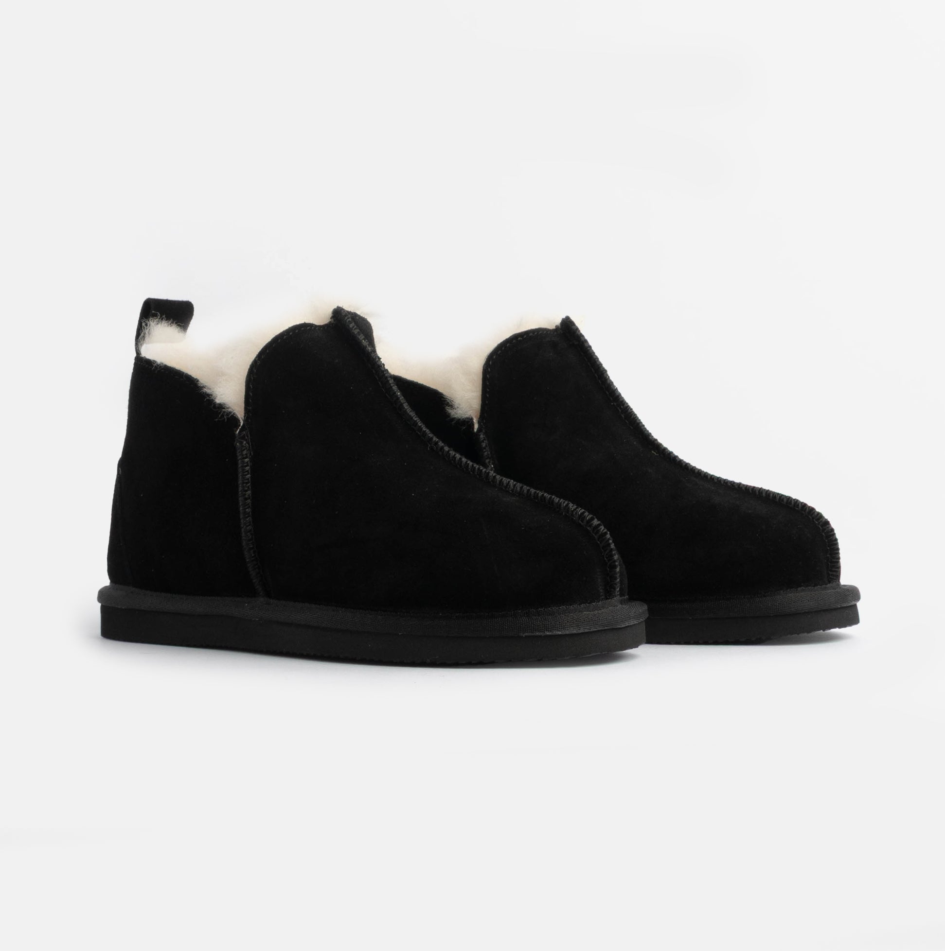 HOS Sheepskin TIA Womens Boot Slippers Black side view showcasing sleek design and soft sheepskin lining.