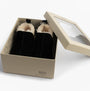 HOS Sheepskin TIA Womens Boot Slippers Black in gift box, showcasing the black slipper boots with sheepskin lining.