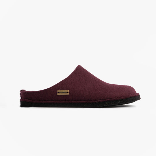Haflinger SOFT Womens Slippers Bordeaux side view of mules with textile upper and rubber sole, showcasing slip-on style.