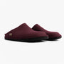 Haflinger SOFT Womens Slippers Bordeaux side view of mules with round toe and rubber sole.