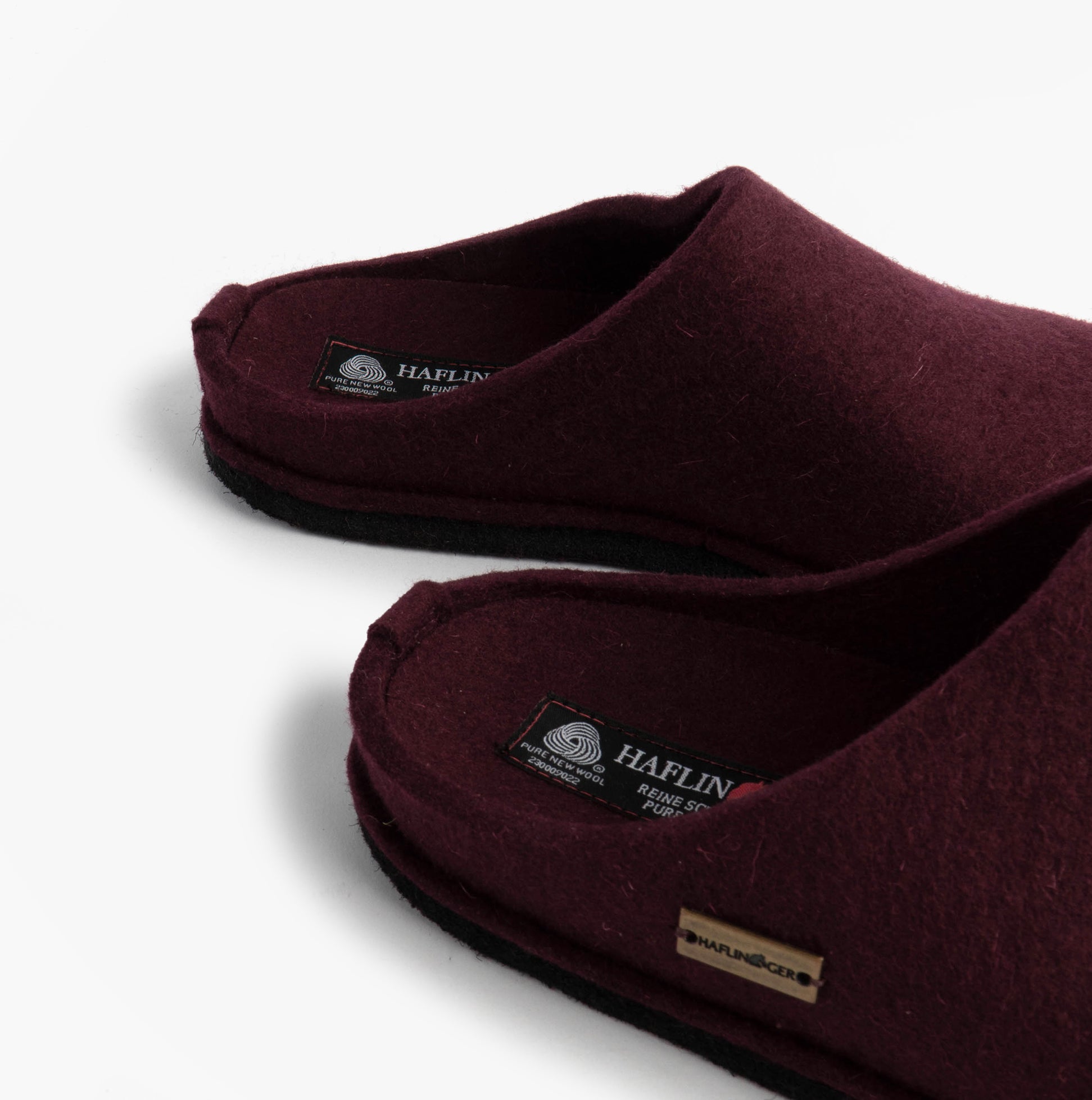 Haflinger SOFT Womens Slippers Bordeaux detail view showing the slip-on mules with a round toe shape and textile upper.