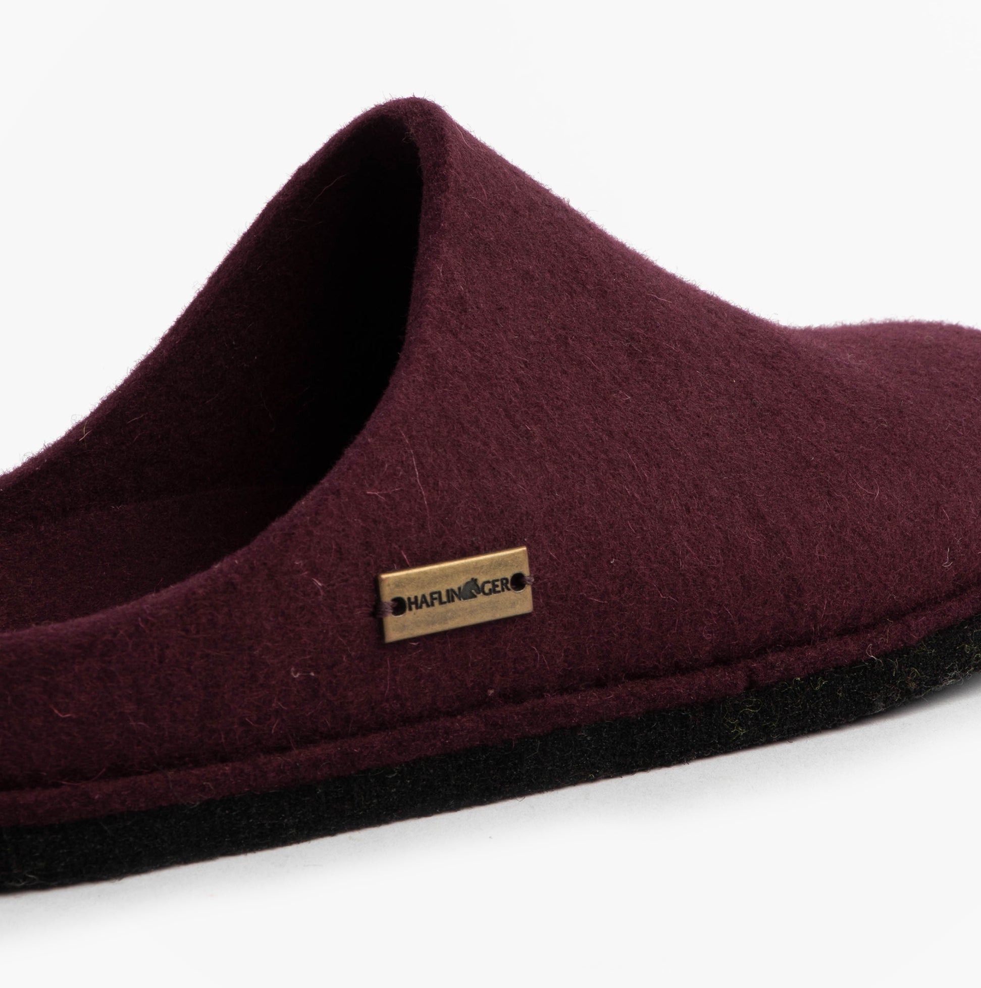 Haflinger SOFT Womens Slippers Bordeaux side view showing soft textile upper and round toe design.