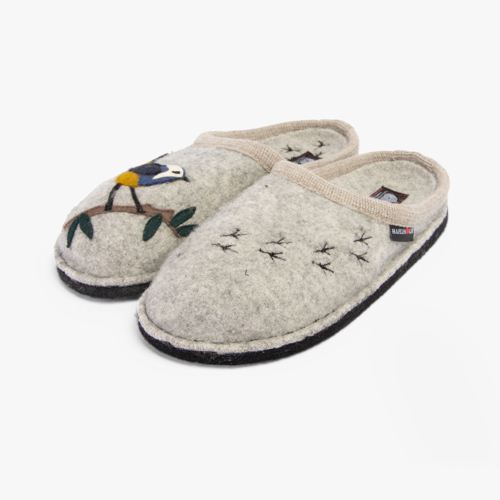 Haflinger SONGBIRD Womens Slippers Mottled Stone Grey side view showcasing wool upper and bird embroidery details.