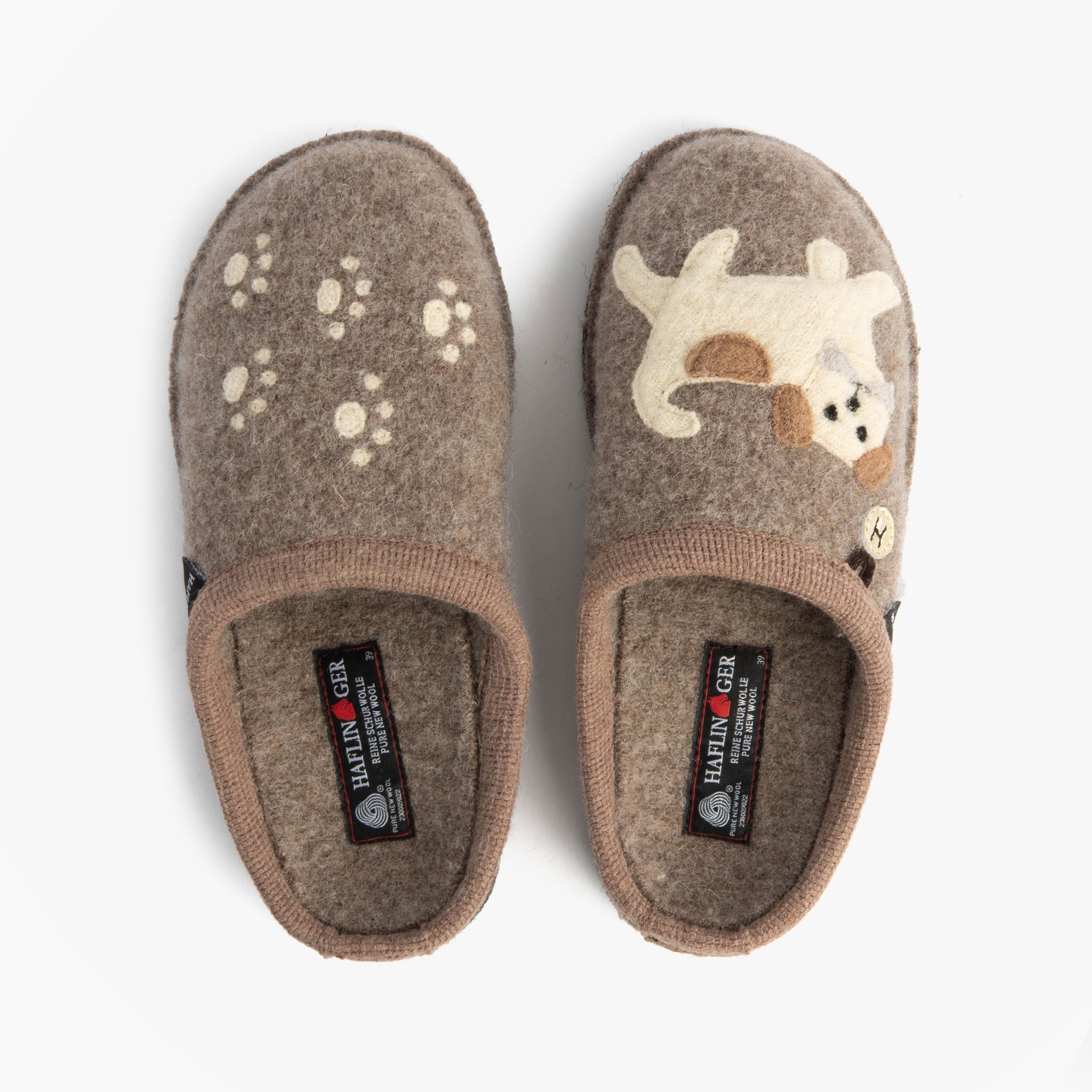 Haflinger FIDO Womens Slippers Beige top view showing side designs and textures of mules with dog and paw prints.