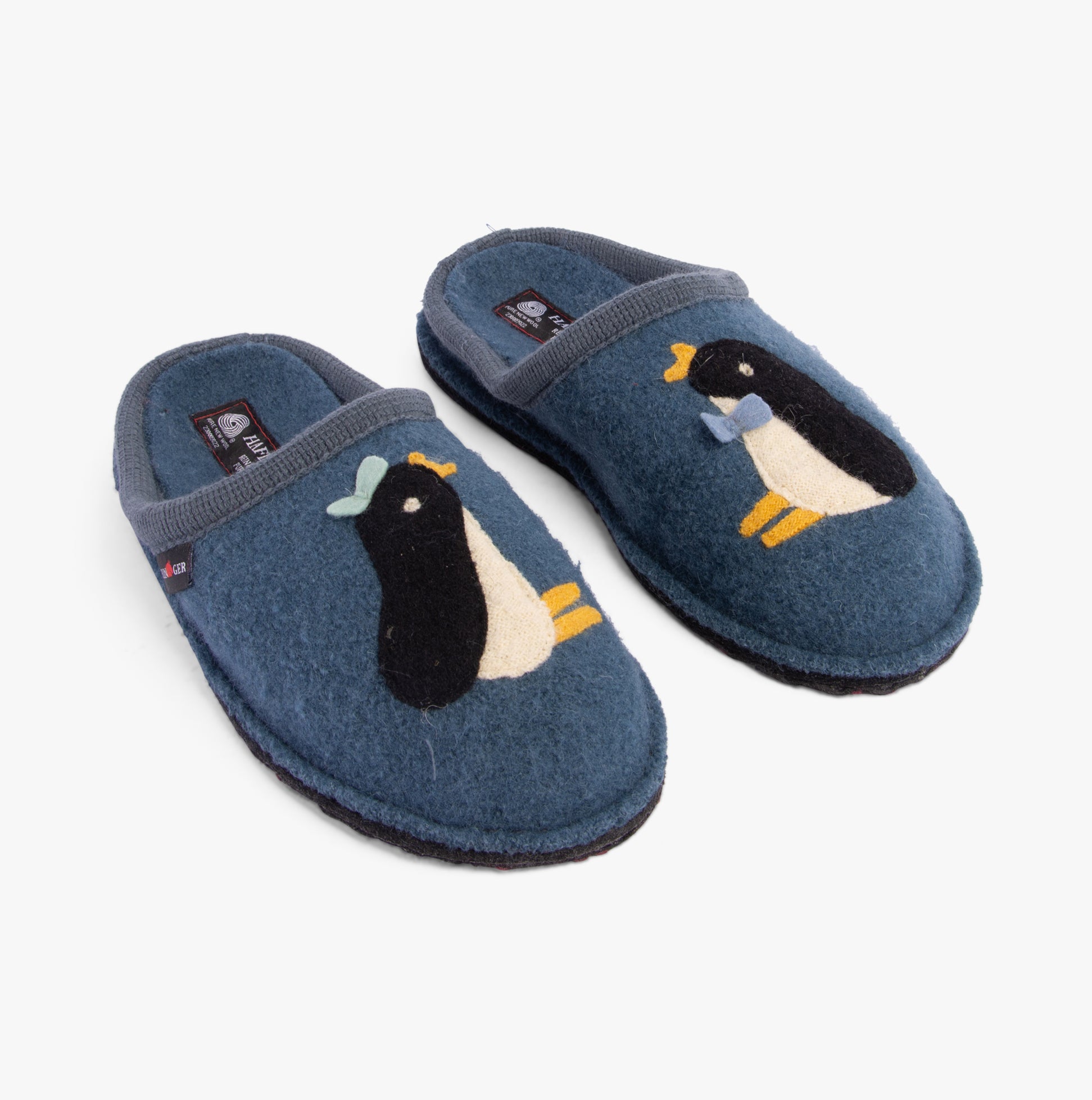 Haflinger PINGU Womens Slippers Powder Blue side view showcasing wool upper with penguin designs.