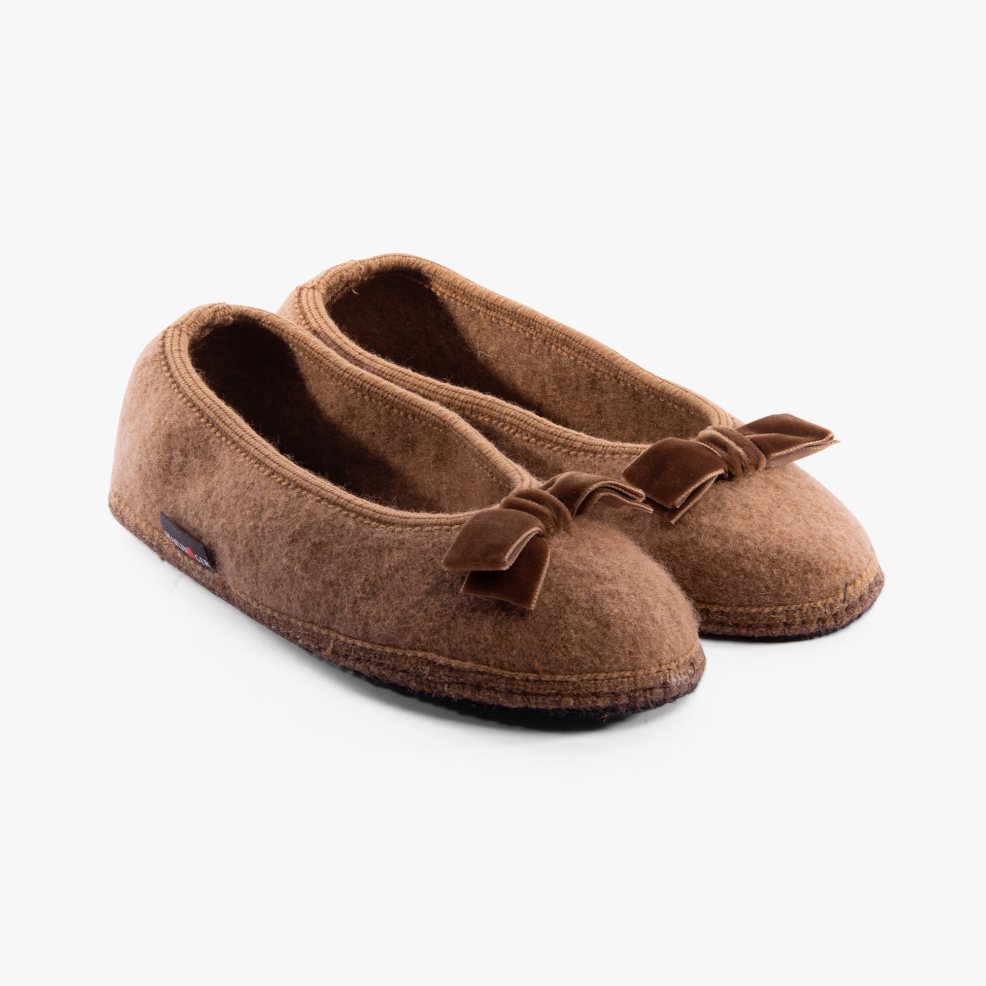 Haflinger FIOCCO Womens Slippers Camel side view with bow detail, soft polyester material, comfortable flat slippers.