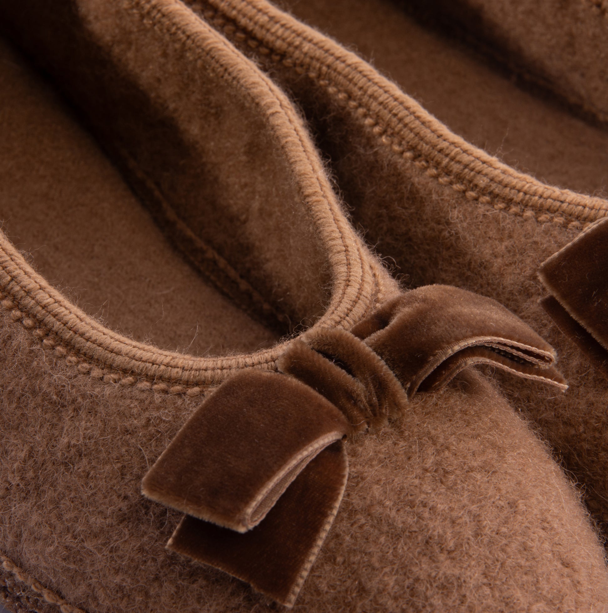 Haflinger FIOCCO Womens Slippers Camel detail view showing soft upper material and bow decoration.