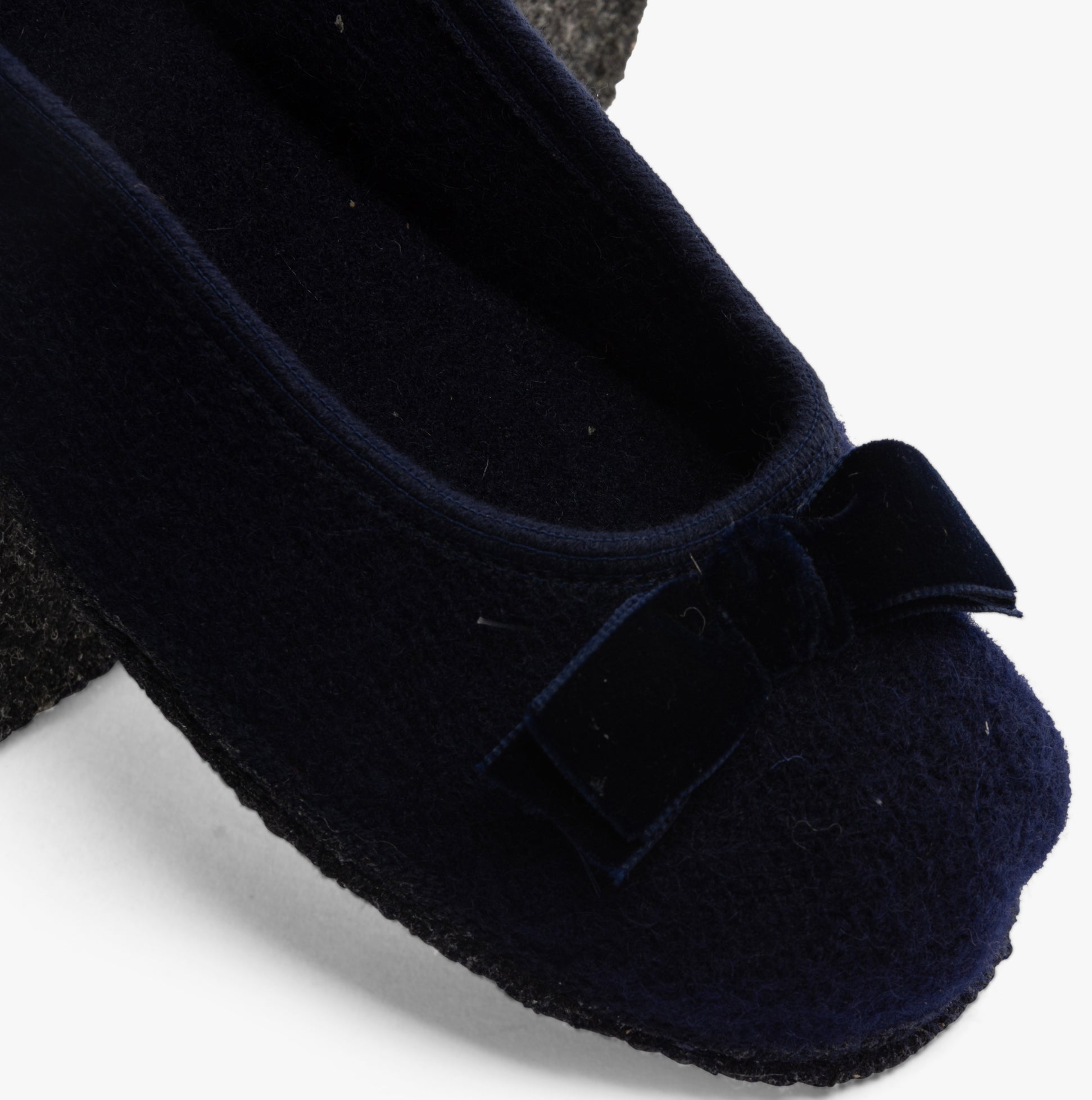 Haflinger FIOCCO Womens Slippers Navy top view showcasing the bow detail and soft fabric.