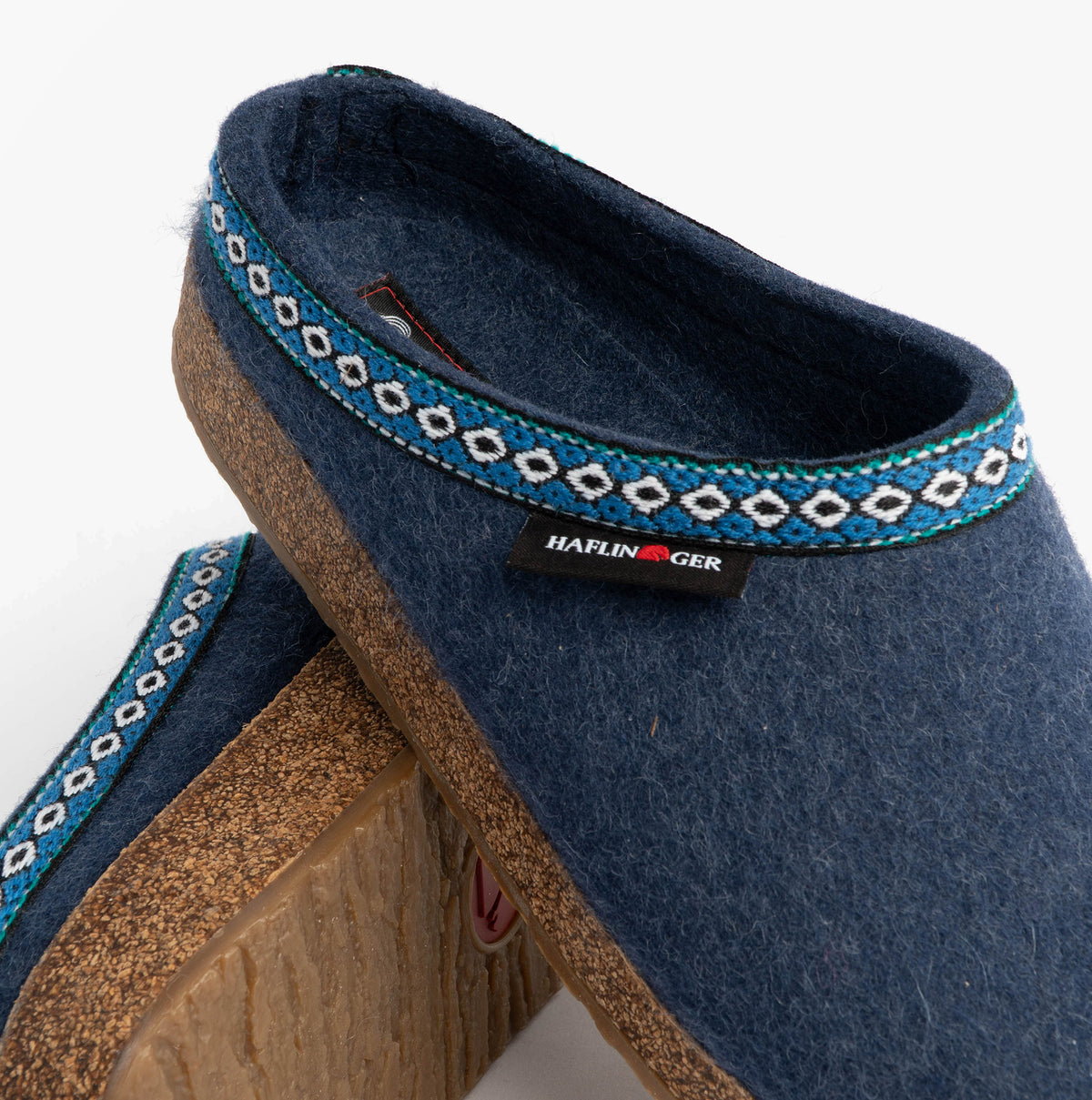 Haflinger FRANZL Womens Felt Clogs Jeans Blue upper side view with textile and cork sole, featuring decorative trim.