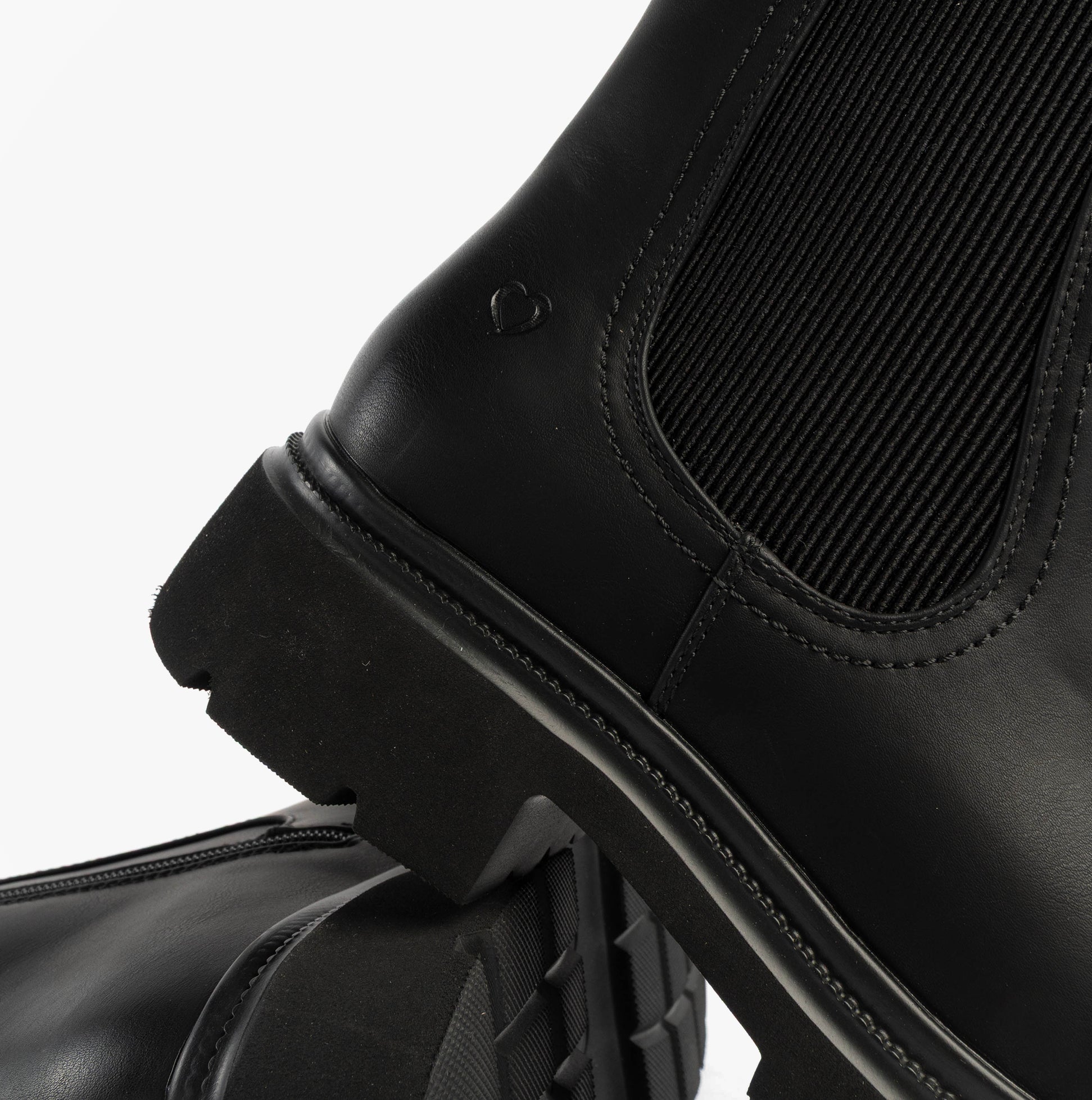 Heavenly Feet ZETA Womens Chelsea Boots Black detail view showing synthetic upper and rubber sole.
