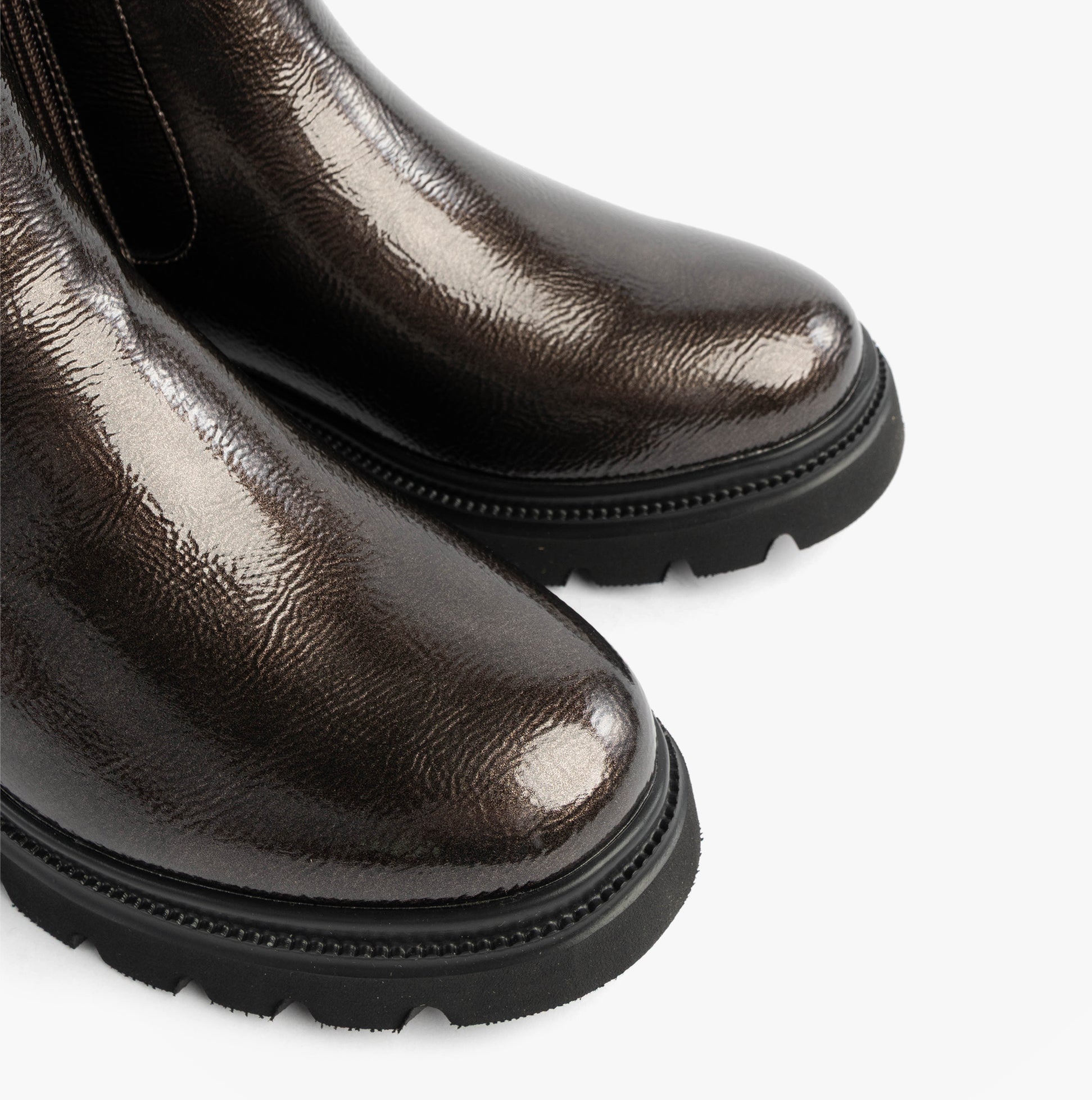 Heavenly Feet ZETA Womens Chelsea Boots Pewter Patent detail view showing shiny upper and round toe.