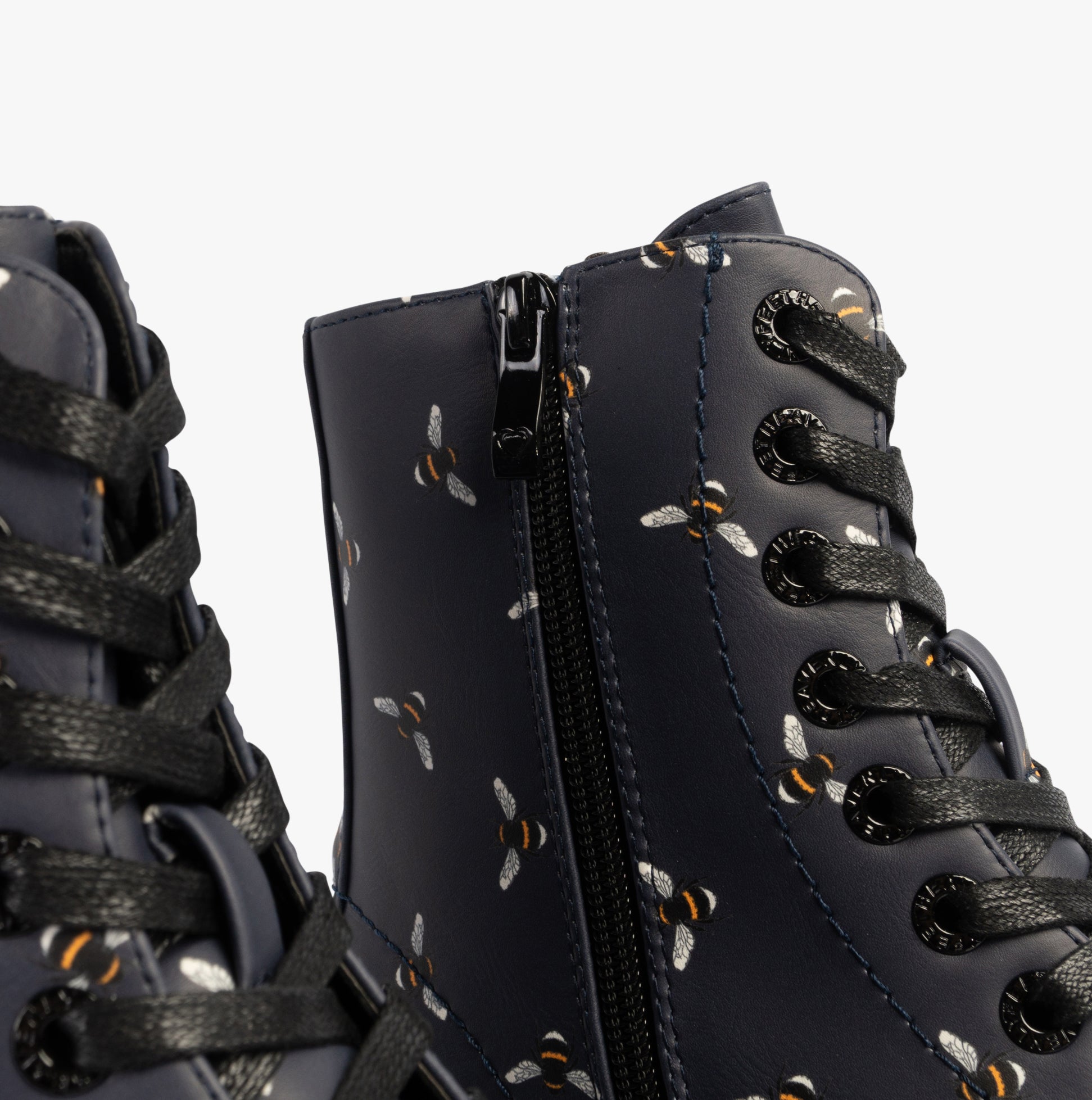 Heavenly Feet JUSTINA2 NEW BEE PRINT Womens Lace Up Boots Midnight detail view showing bee print and zipper.
