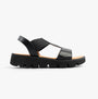 Heavenly Feet RITZ Womens Sandals Black side view showing synthetic upper and wedge rubber sole.