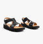 Heavenly Feet RITZ Womens Sandals Black side view showcasing the stylish vegan slip-on design and wedge heel.