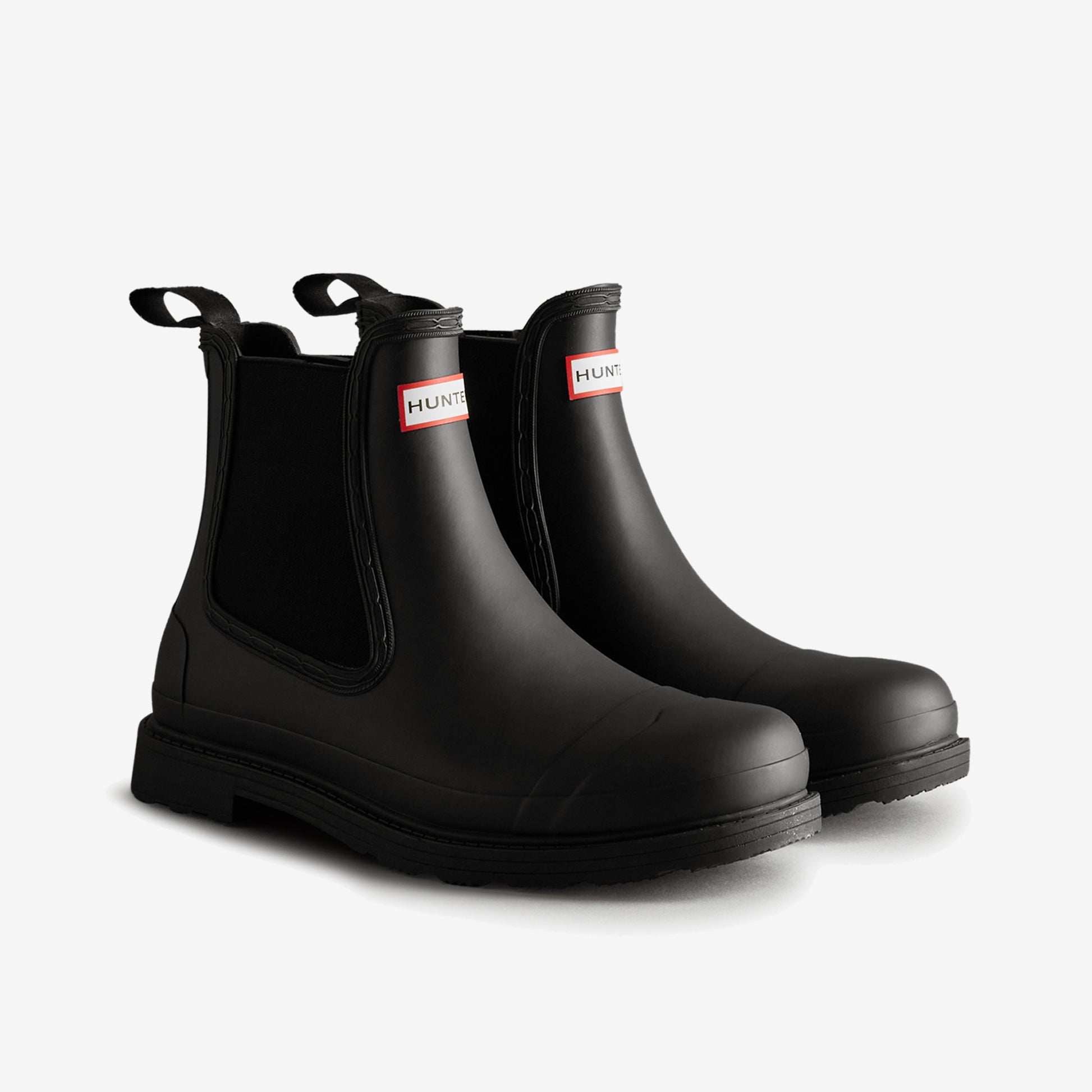 Hunter COMMANDO CHELSEA Mens Wellies Black side view with pull-on design, rubber upper, and slip-resistant sole.