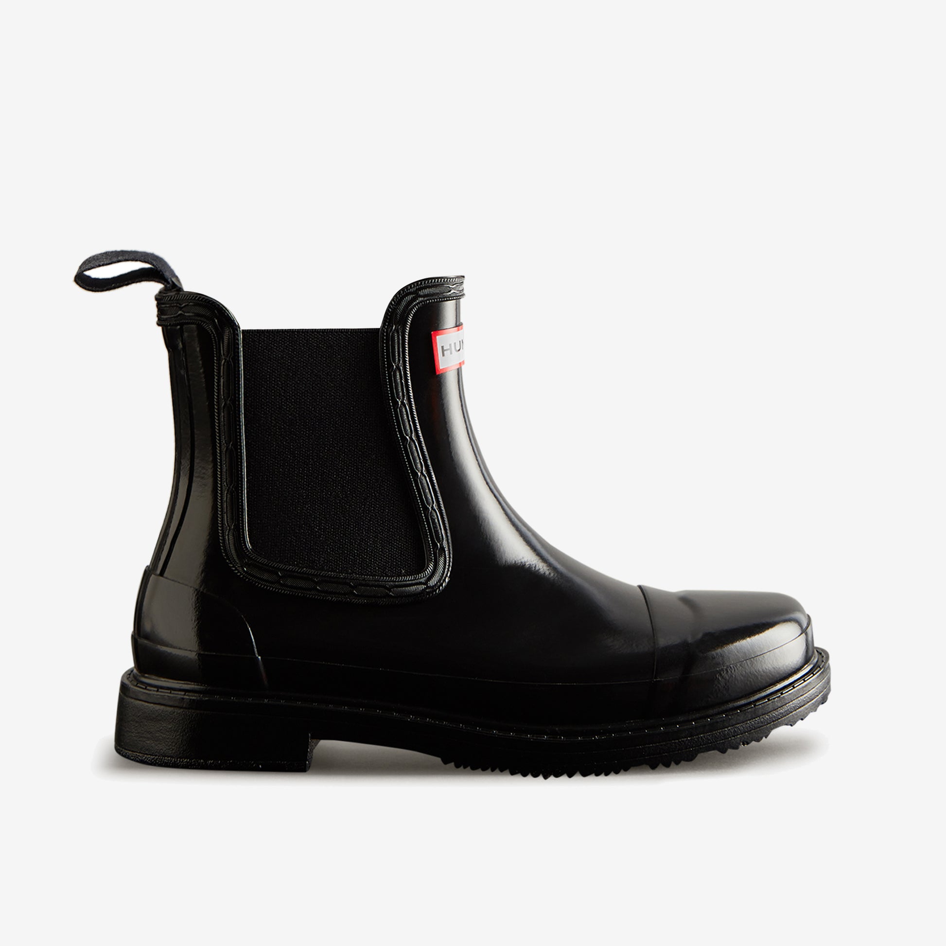 Hunter CHELSEA COMMANDO Womens Wellies Black Gloss side view of rubber ankle boot with pull-on design.