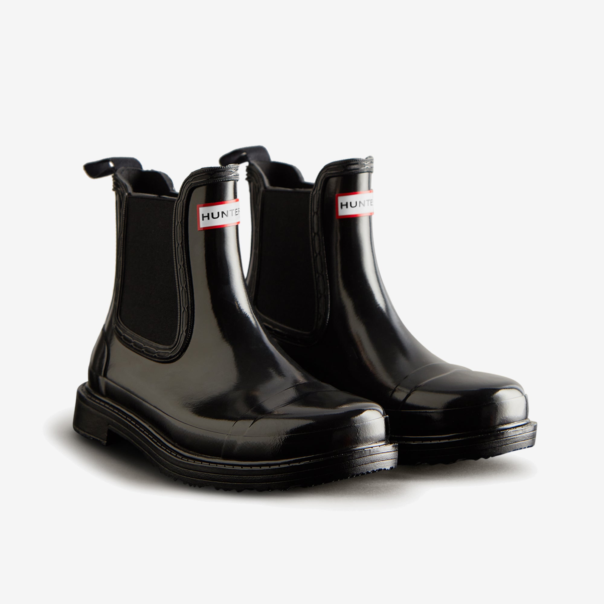 Hunter CHELSEA COMMANDO Womens Wellies Black Gloss front view showcasing stylish rubber pull-on ankle boots.