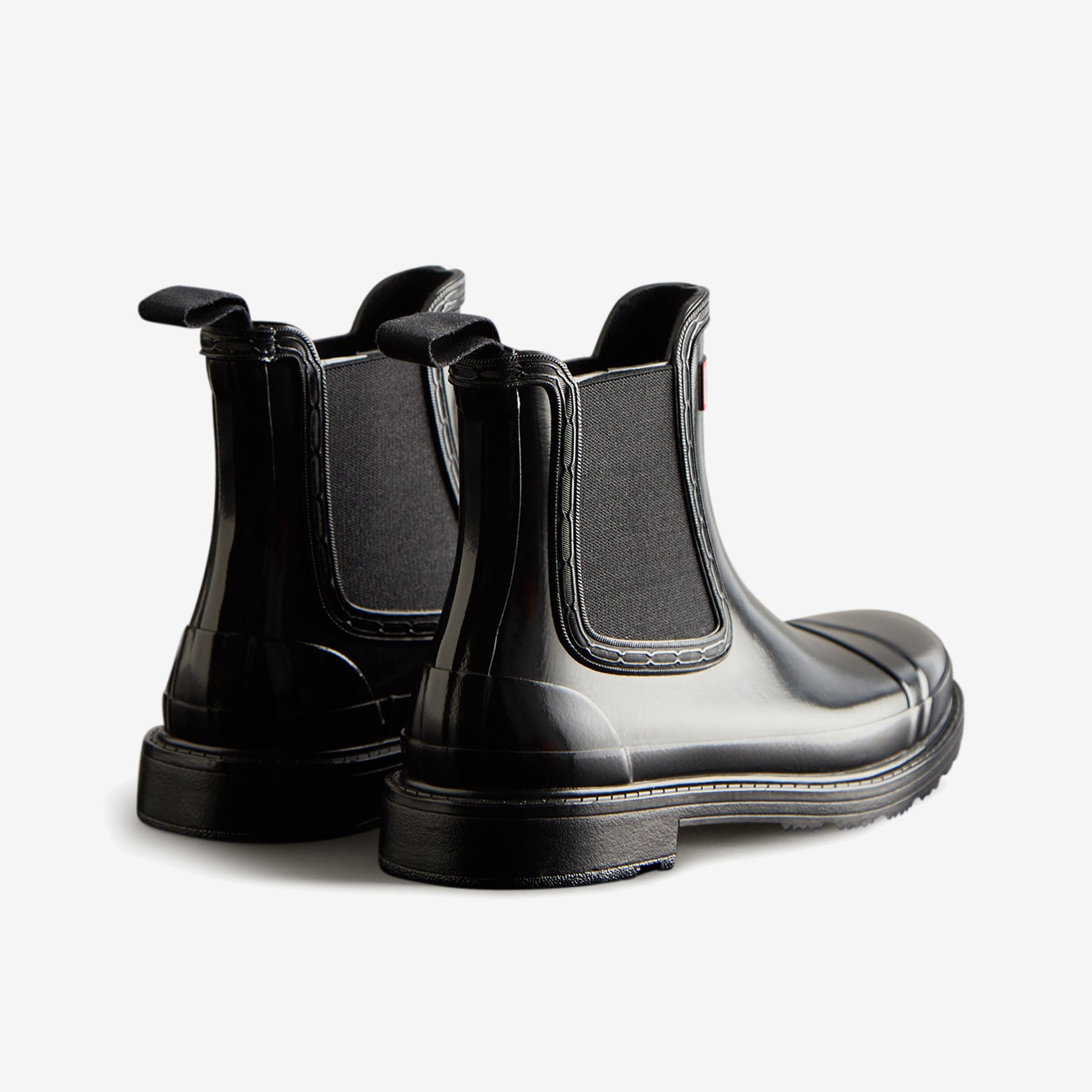 Hunter CHELSEA COMMANDO Womens Wellies Black Gloss back view showing sleek design and elastic side panels.