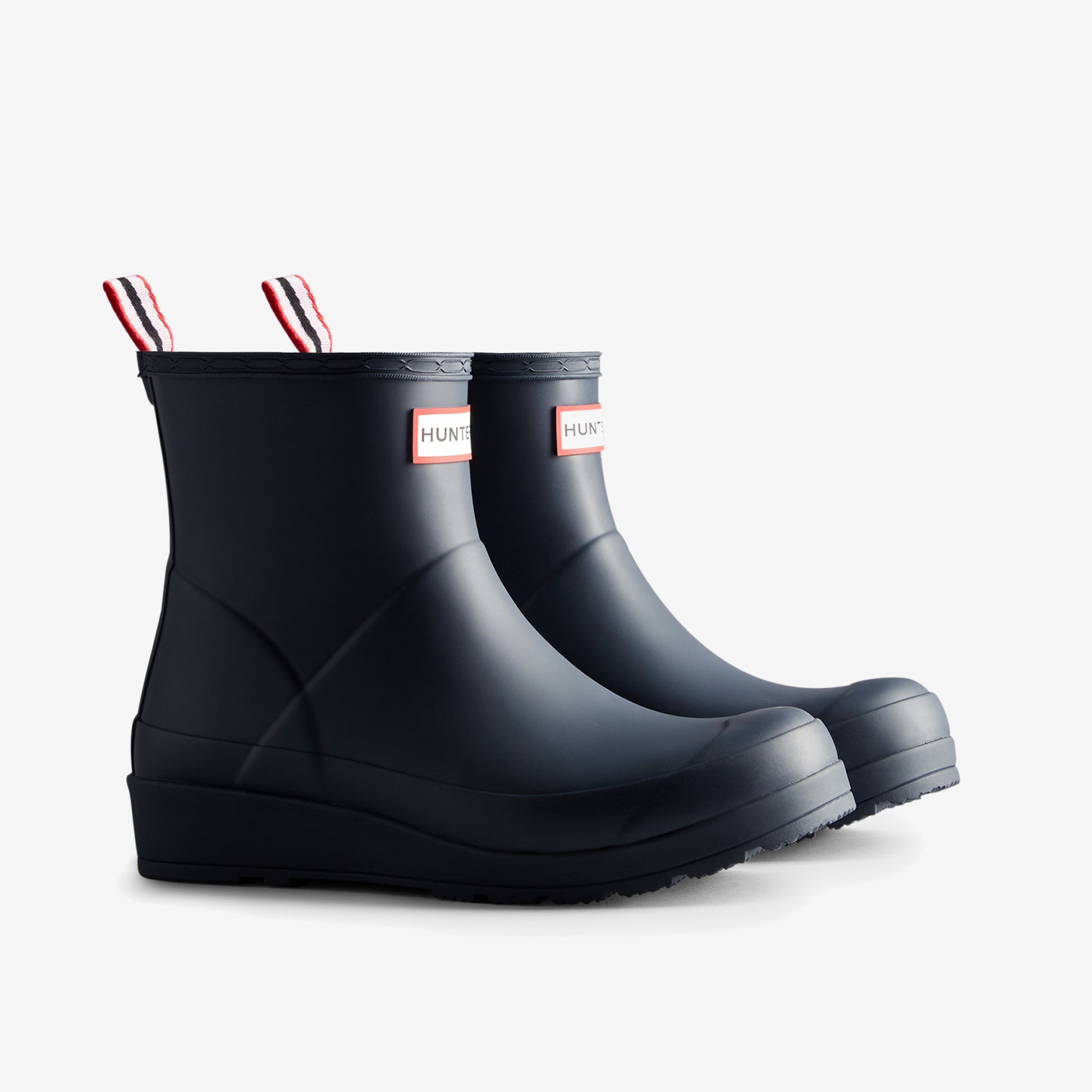 Hunter PLAY SHORT Womens Wellies Valtameri Blue side view showing rubber ankle boot with wedge heel.