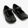 Hush Puppies AMBER JUNIOR Girls Leather School Shoes Black side view showing adjustable strap and star detail.