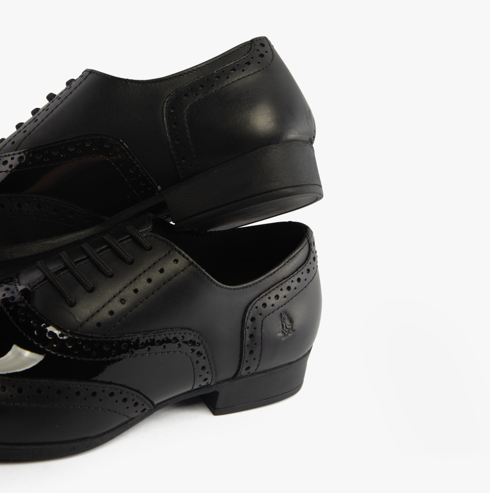 Hush Puppies KADA Girls Leather School Shoes Black side and top view showcasing patent leather upper and lace-up design.
