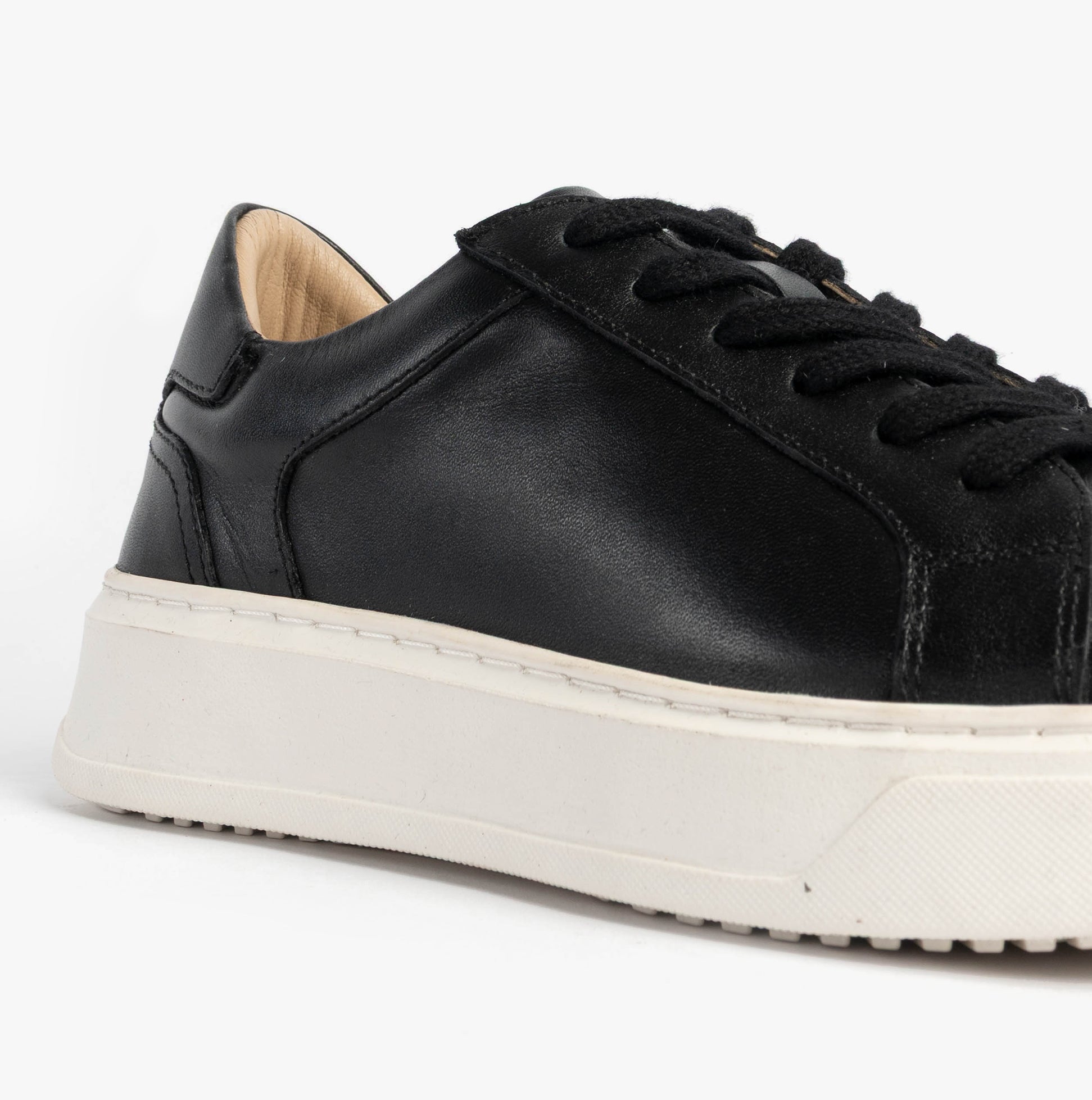 Hush Puppies CAMILLE Womens Trainers Black side view showing leather upper and lace-up design.