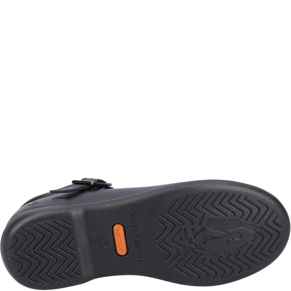 Hush Puppies BRITNEY Girls Leather School Shoes Black bottom view showing tread and buckle details.
