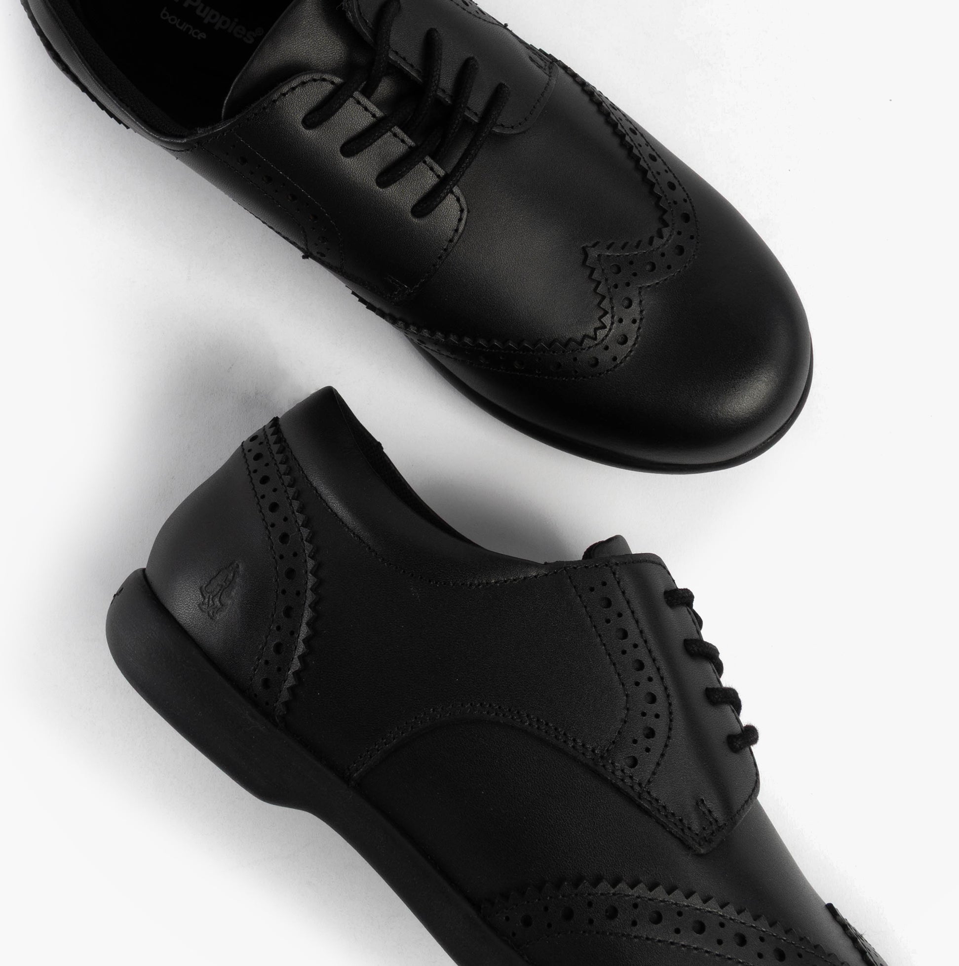 Hush Puppies BRIDGET Girls Leather School Shoes Black top view showcasing lace-up design and round toe.