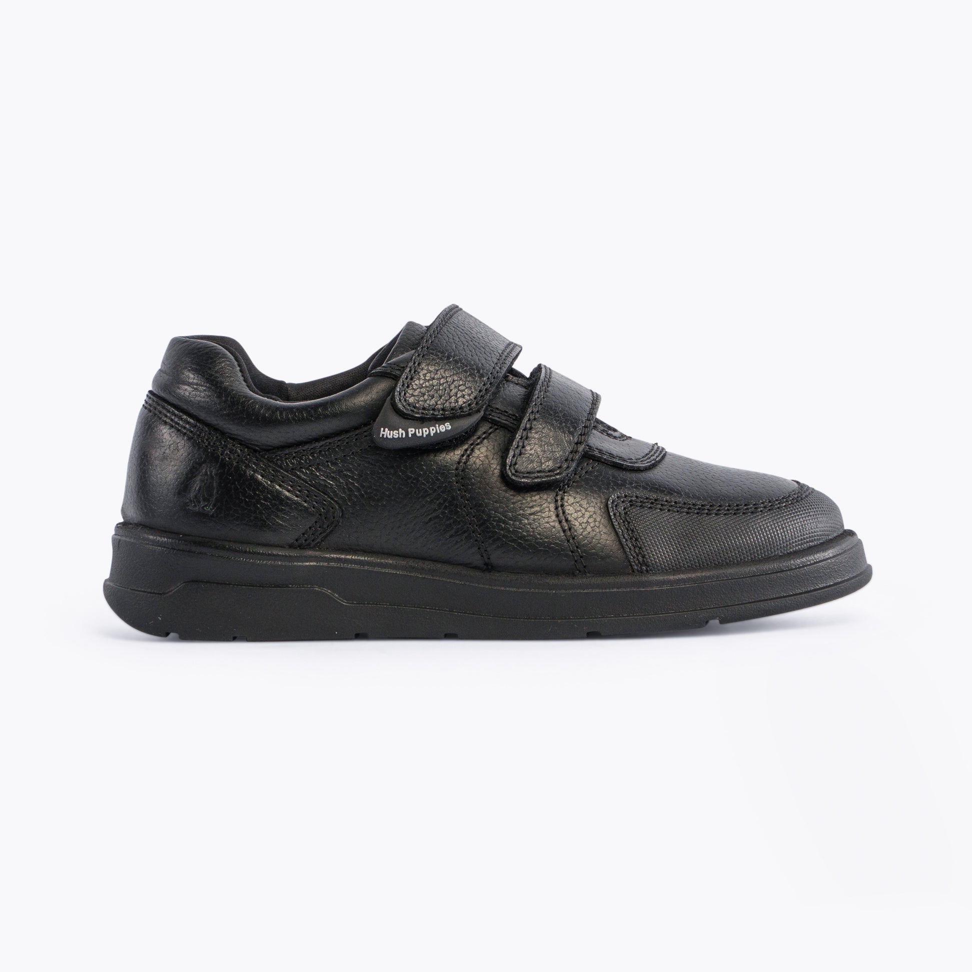 Hush Puppies RYAN Boys Leather School Shoes Black side view showcasing casual design with touch fasten closure.
