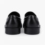 Hush Puppies TOBY SENIOR Boys Shoes Black rear view, showcasing sleek black leather design and low-top comfort.