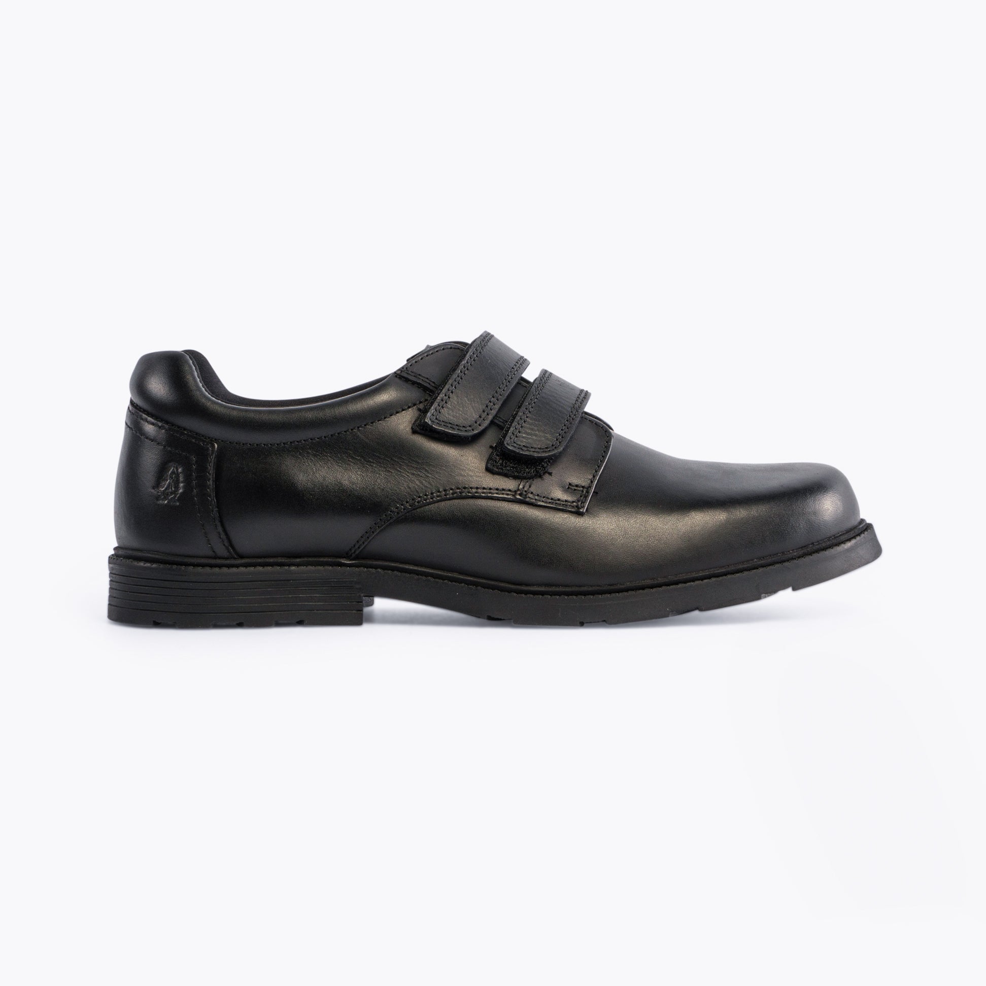 Hush Puppies LOGAN SNR Boys Shoes Black side view with touch fastening straps and low top design.