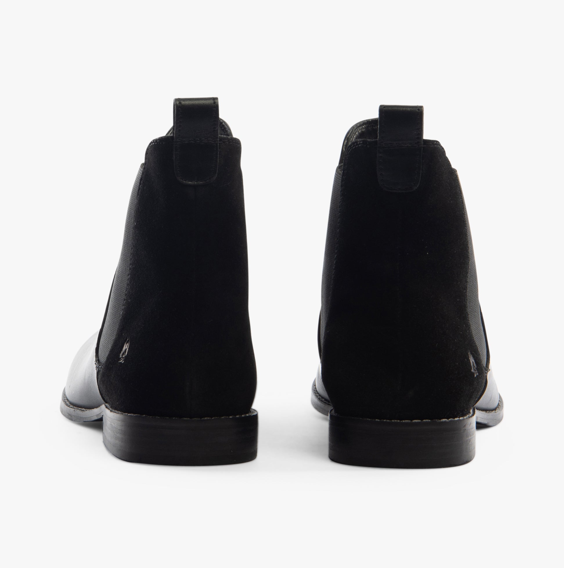 Hush Puppies COLETTE Womens Boots Black rear view, showcasing the sleek black leather and ankle-height design.