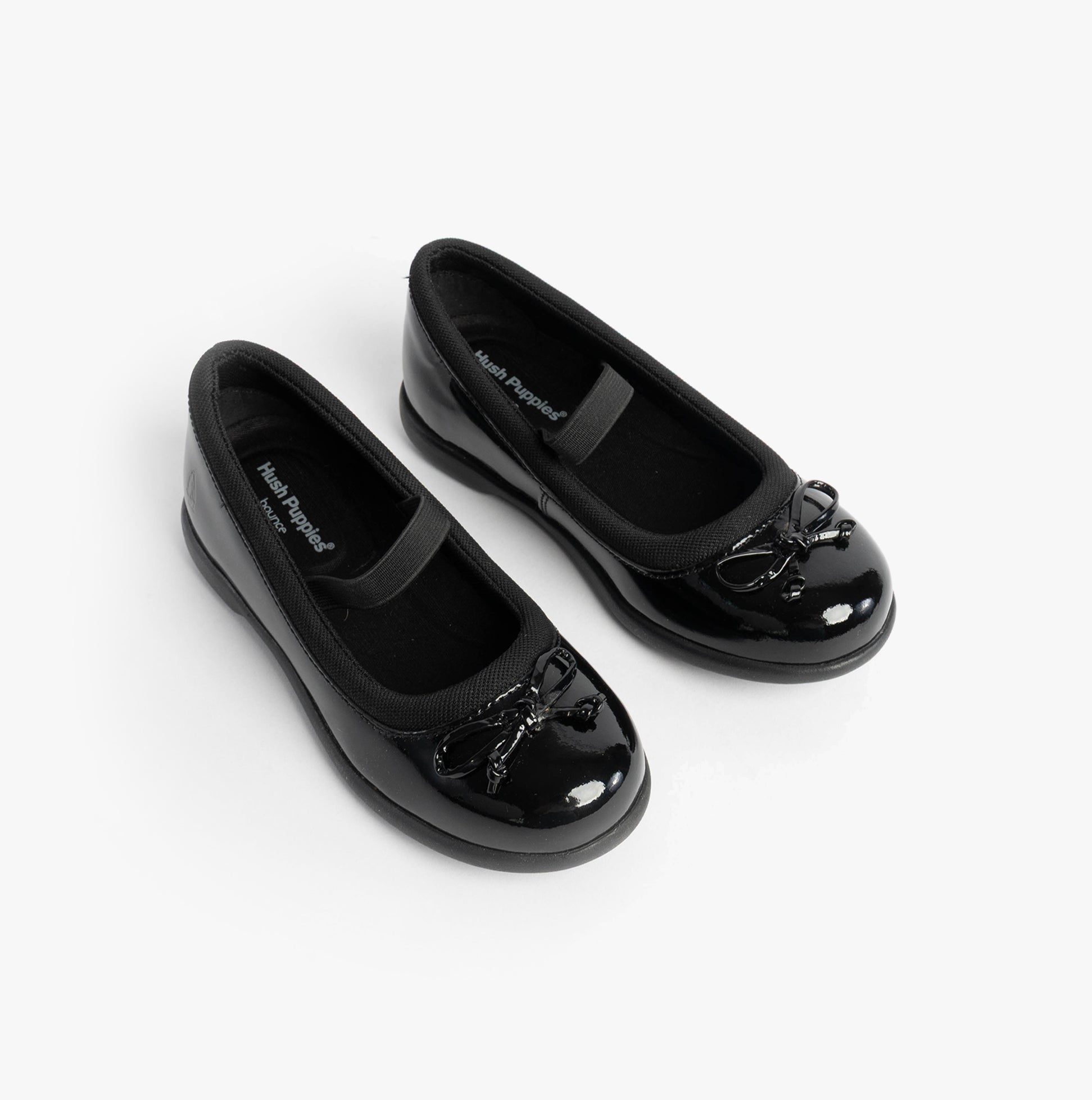 Hush Puppies BETTY PATENT JNR Girls Shoes Black top view showing two pairs with bows, ideal school shoes for comfort and style.