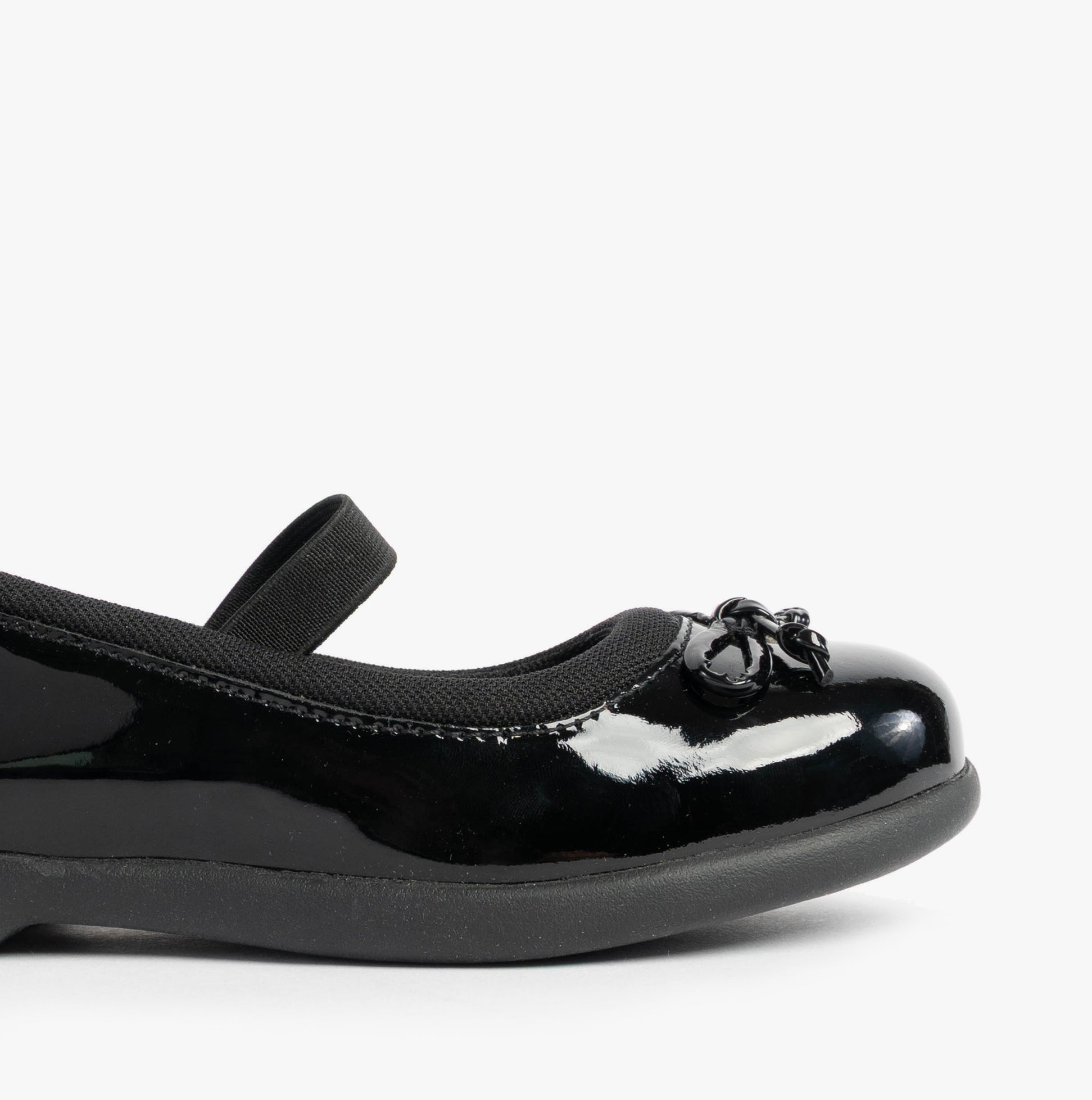 Hush Puppies BETTY PATENT JNR Girls Shoes Black side view showing patent leather upper and round toe design.