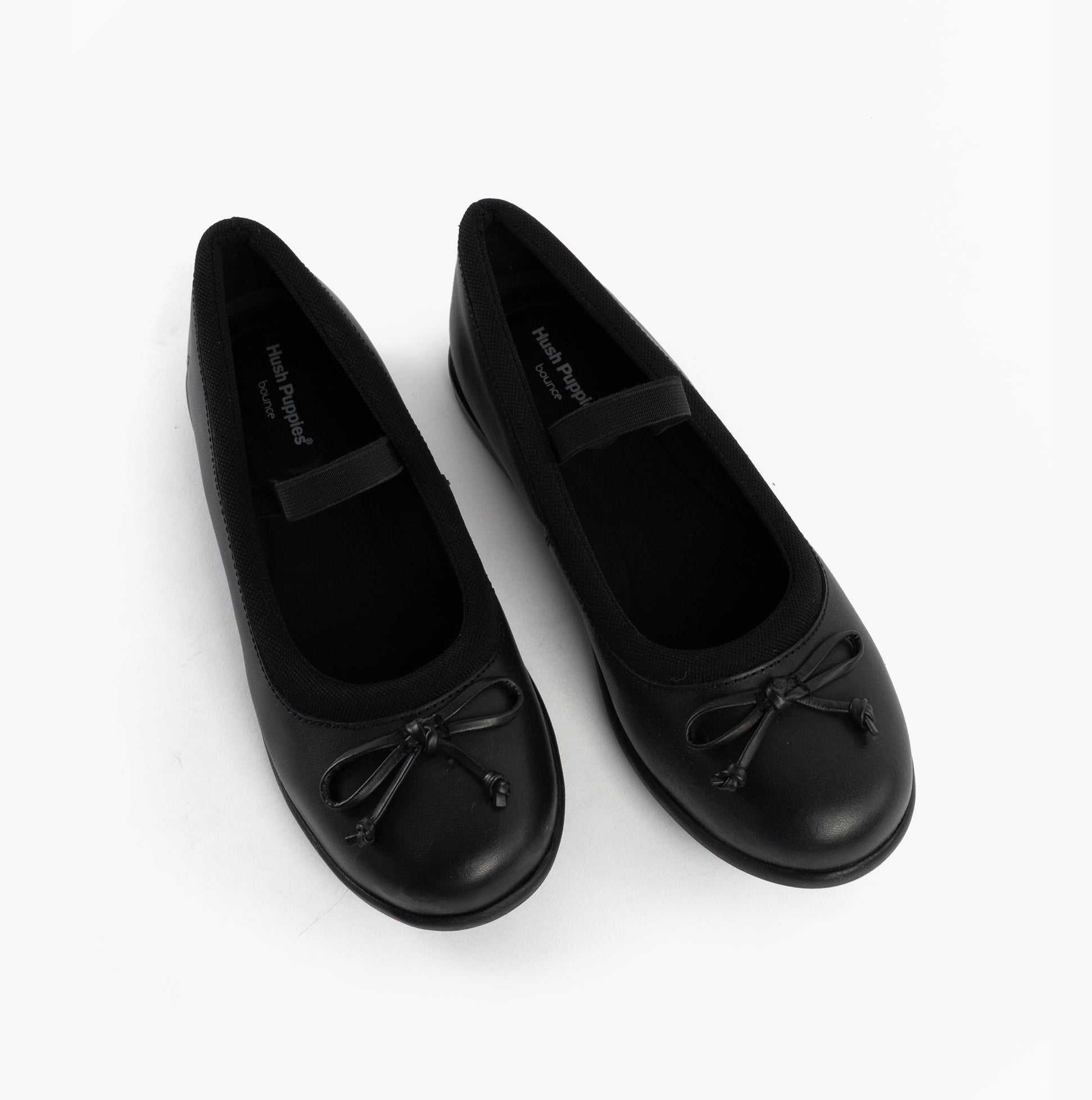 Hush Puppies BETTY JNR Girls Shoes Black top view showcasing classic slip-on style and round toe design.