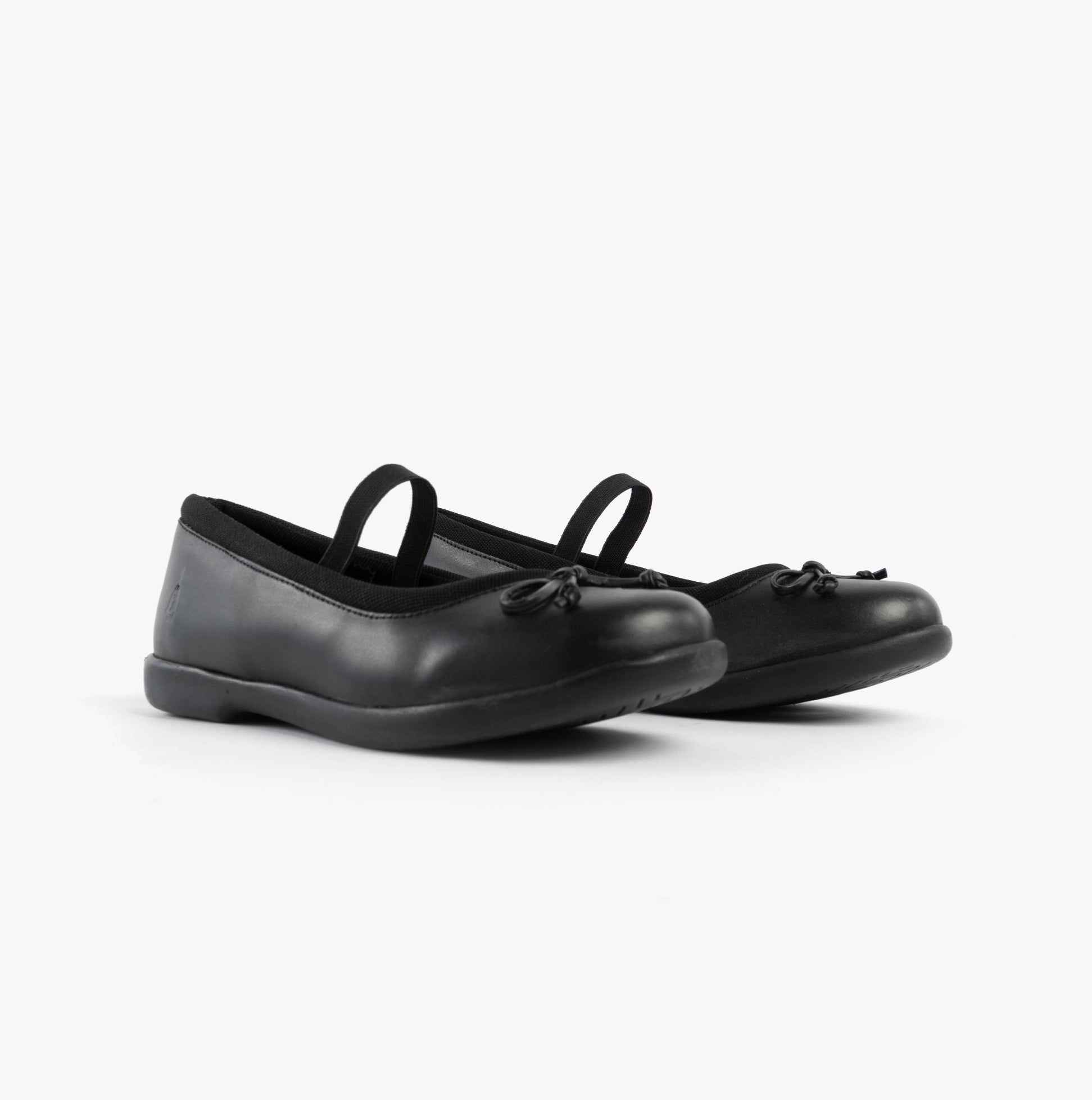 Hush Puppies BETTY JNR Girls Shoes Black side view showcasing leather upper, slip-on design, and round toe.