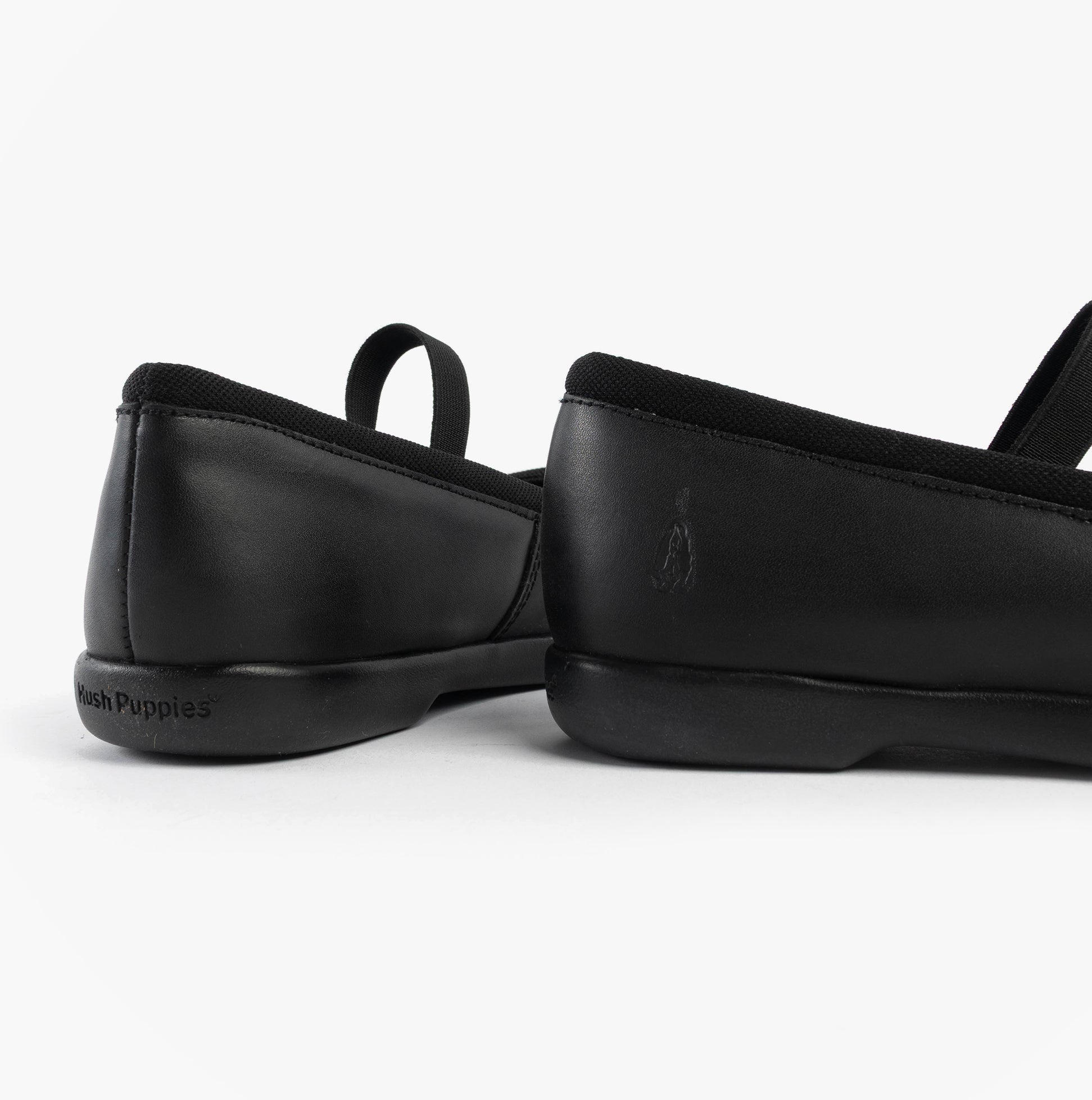 Hush Puppies BETTY JNR Girls Shoes Black back view showing leather upper and slip-on design.