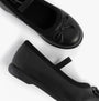 Hush Puppies BETTY JNR Girls Shoes Black top and side view showcasing slip-on design and round toe.