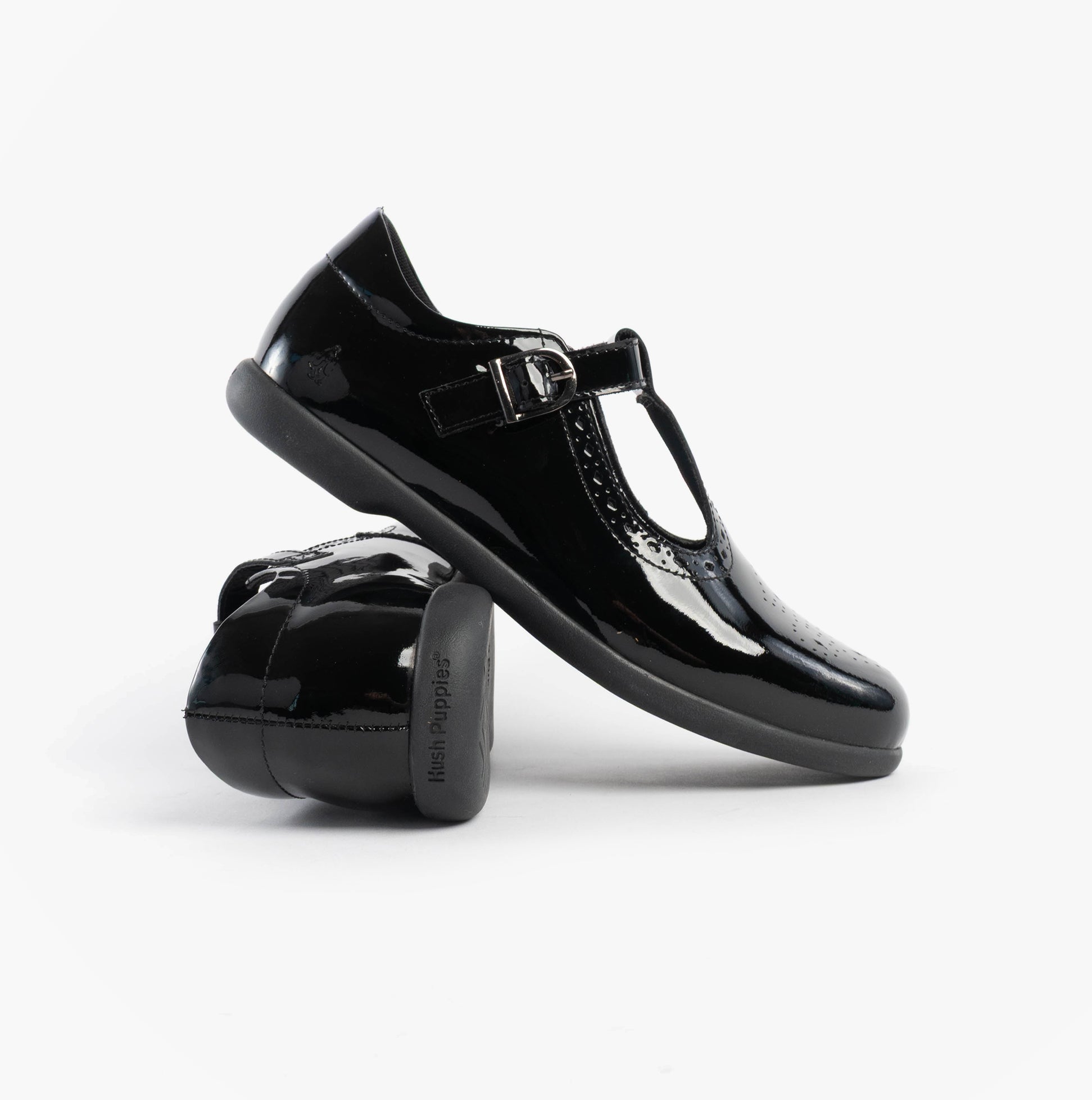 Hush Puppies BRITNEY PATENT Girls Shoes Black side view showcasing patent leather and buckle closure.