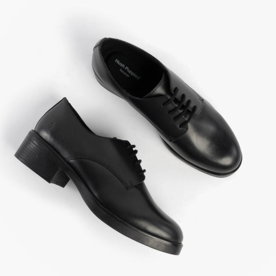Hush Puppies ANASTASIA Girls Leather School Shoes Black top view showcasing detailed design and lace-up closure.