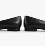 Hush Puppies LOLA Girls School Shoes Black side view showcasing sleek leather design and flat heel.
