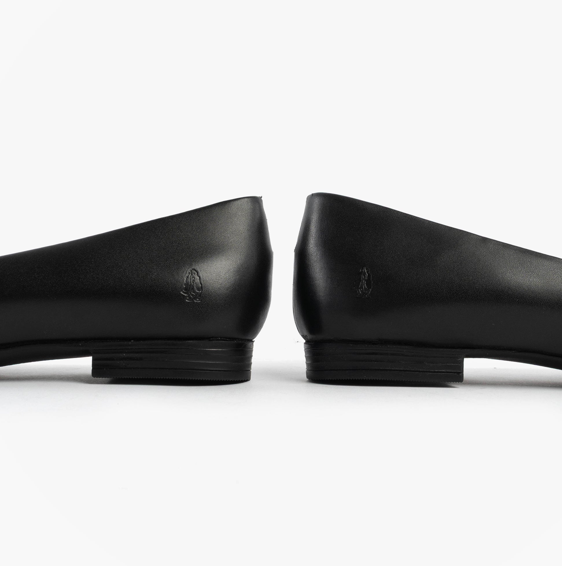 Hush Puppies LOLA Girls School Shoes Black side view showcasing sleek leather design and flat heel.